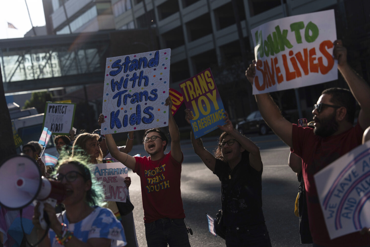 FILE - Protesters chant slogans while demonstrating against the closure of the trans youth clinic a...