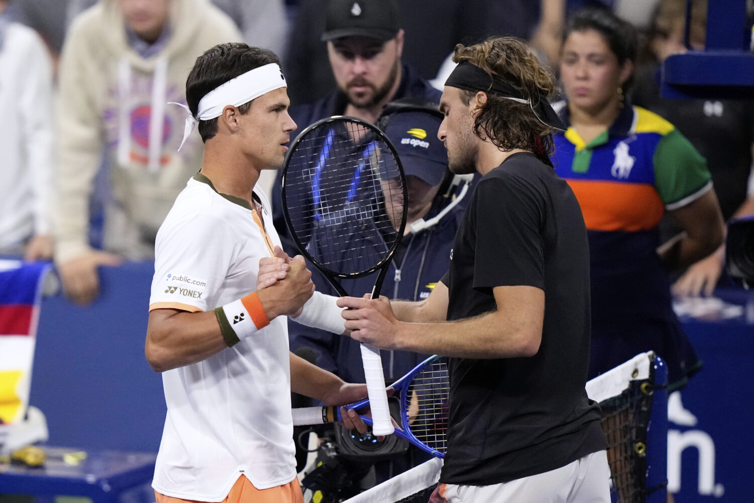 Daniel Altmaier, left, of Germany, is congratulated by Stefanos Tsitsipas, of Greece, after defeati...