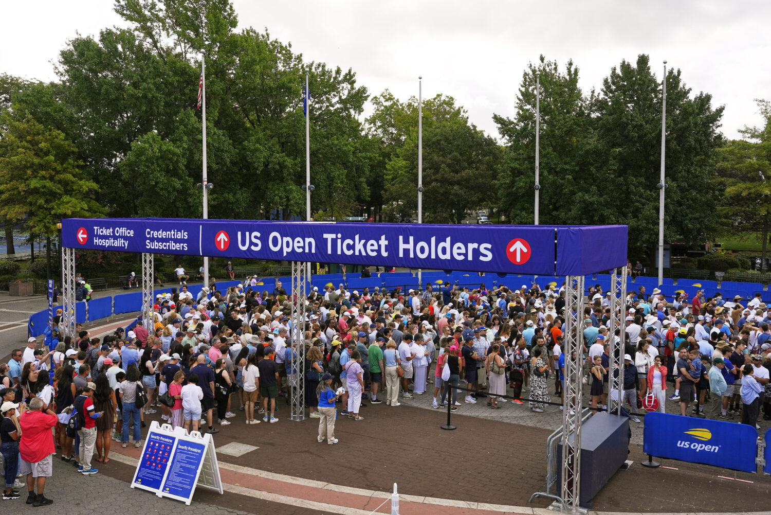 Spectators wait for gates to open at the Billie Jean King National Tennis Center for the first roun...