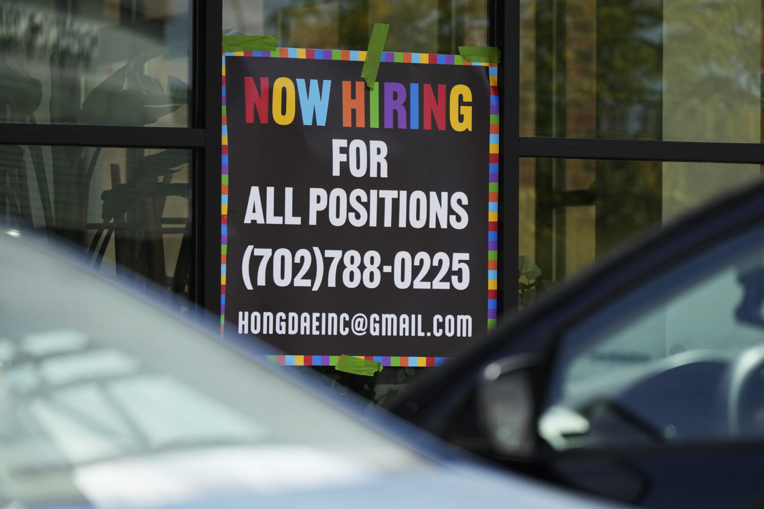 FILE - A hiring sign is displayed at a restaurant in Mount Prospect, Ill., Aug. 27, 2024. (AP Photo...
