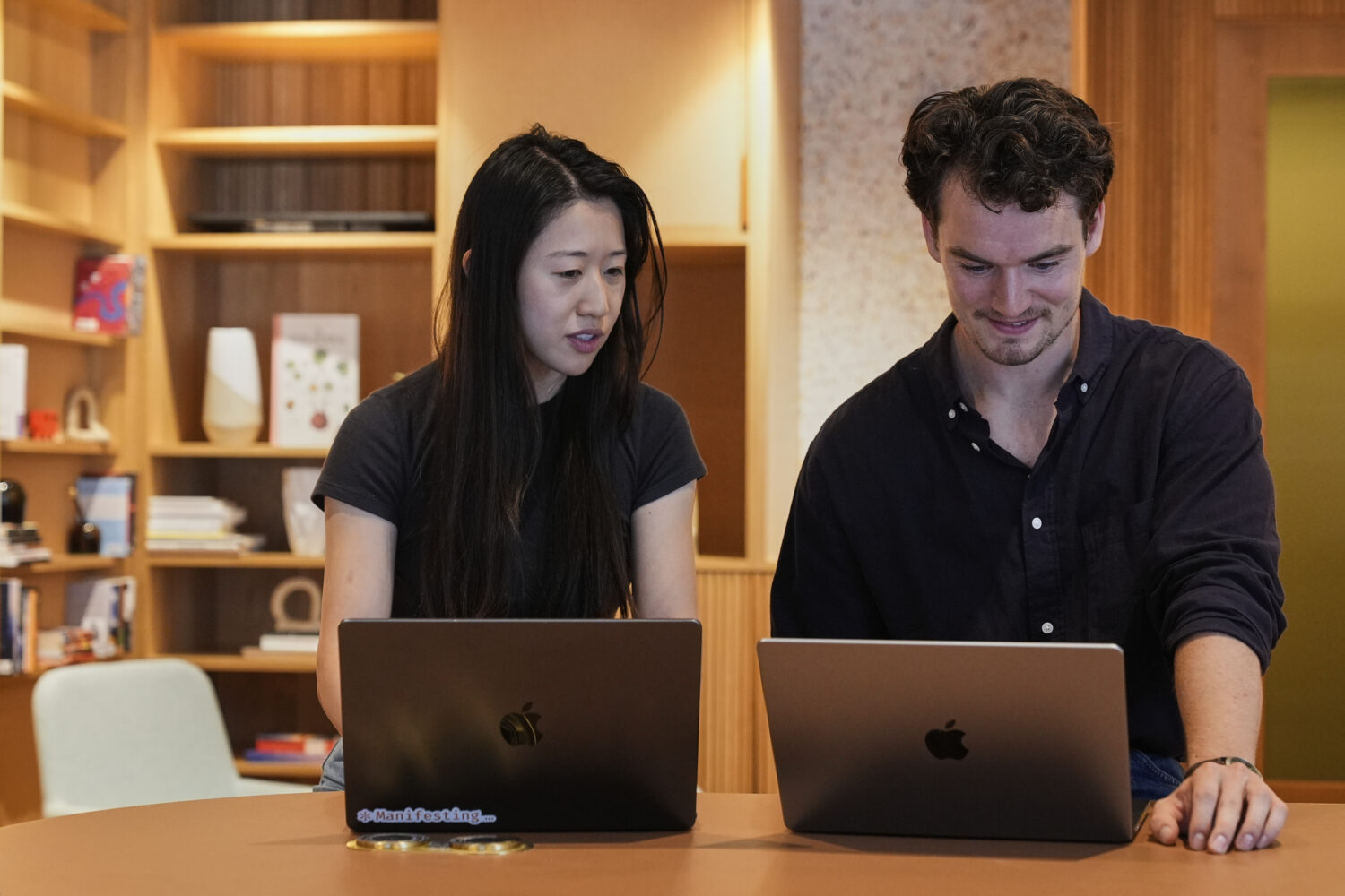 Claude code product manager Cat Wu, left, and Alex Albert, head of Claude relations, work inside An...