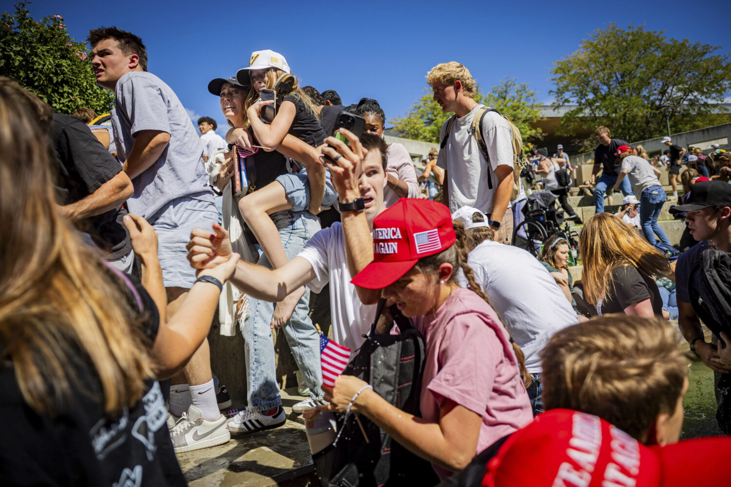 The crowd reacts after Charlie Kirk, the CEO and co-founder of the conservative youth organization ...