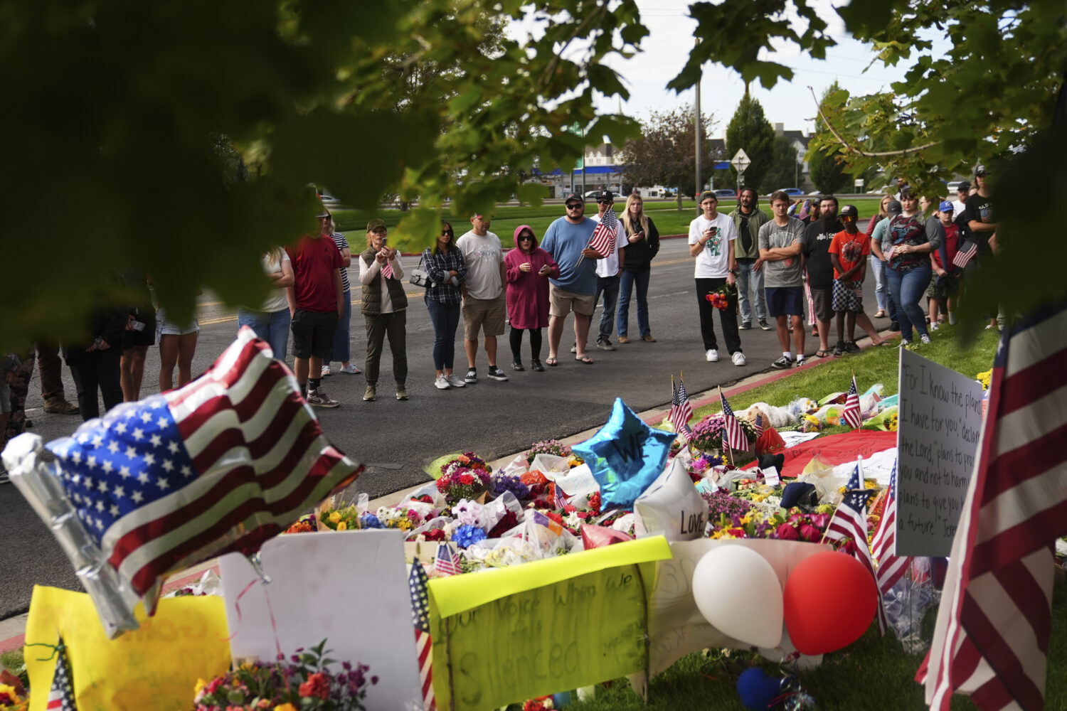Supporters gather at a makeshift memorial in Orem, Utah, Saturday, Sept. 13, 2025, at Utah Valley U...