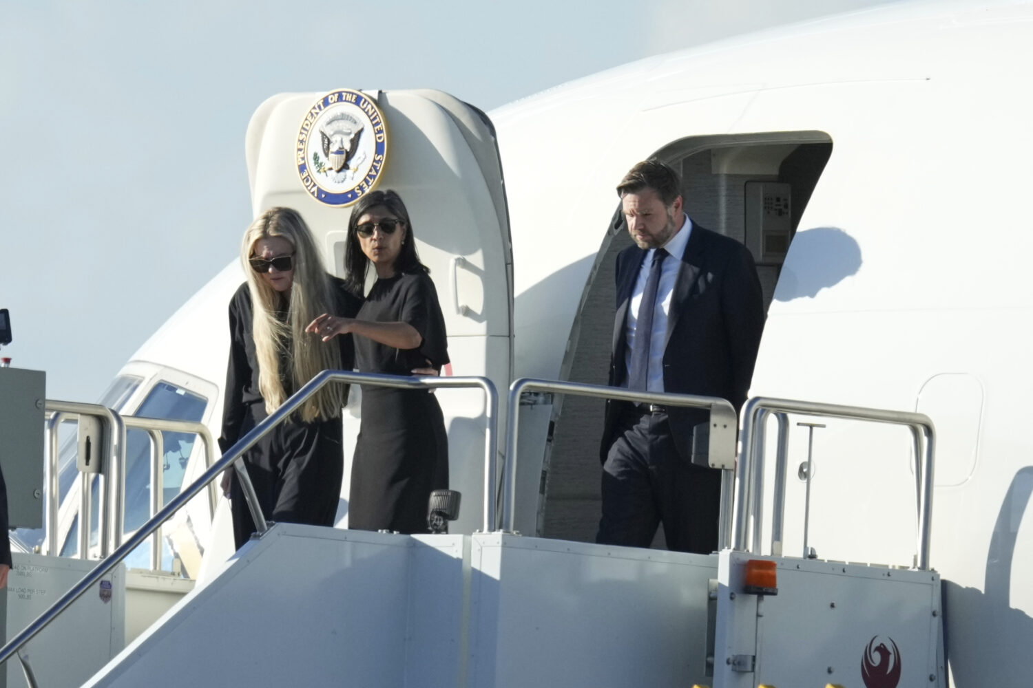 Vice President JD Vance, right, Second Lady Usha Vance, center, and Erika Kirk deplane Air Force Tw...