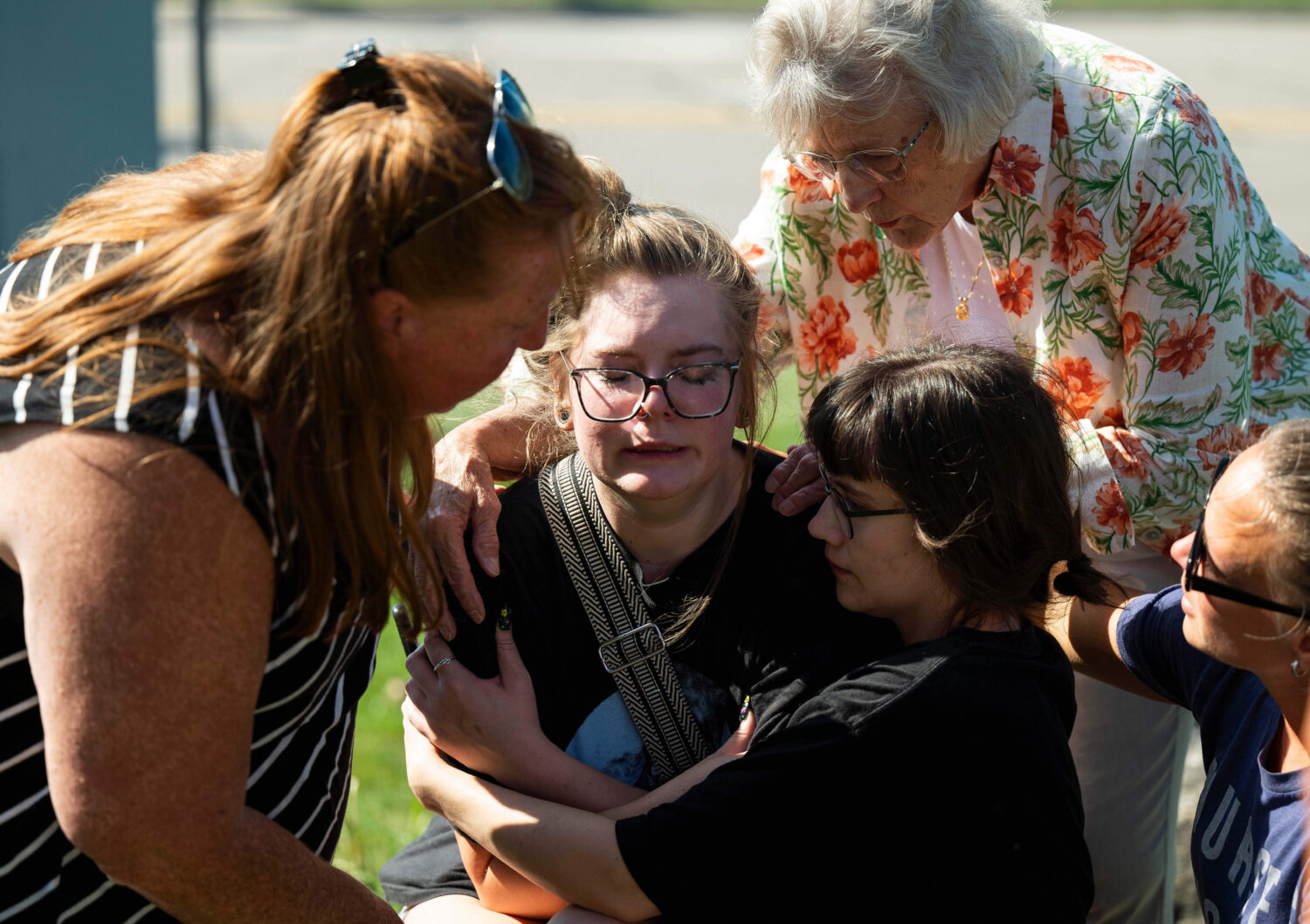 Joanne Green of Fenton, 75, top right, and McKenna Harrington of Davison, 25, second from right, co...