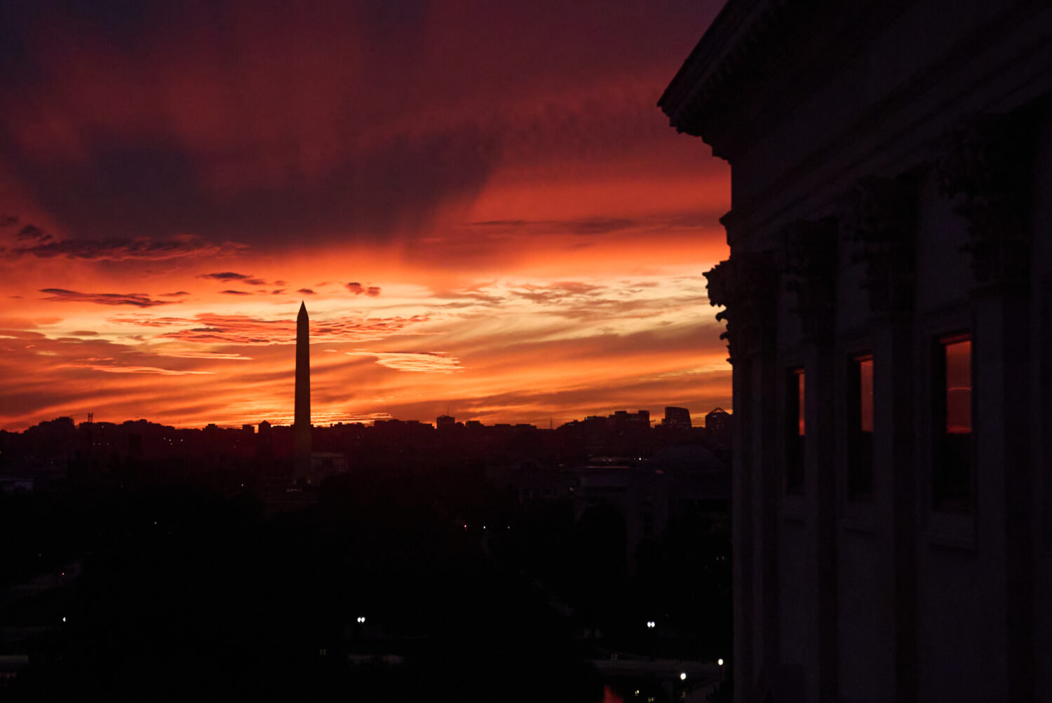 The sunset is seen from the Capitol before Republican and Democratic news conferences about the gov...