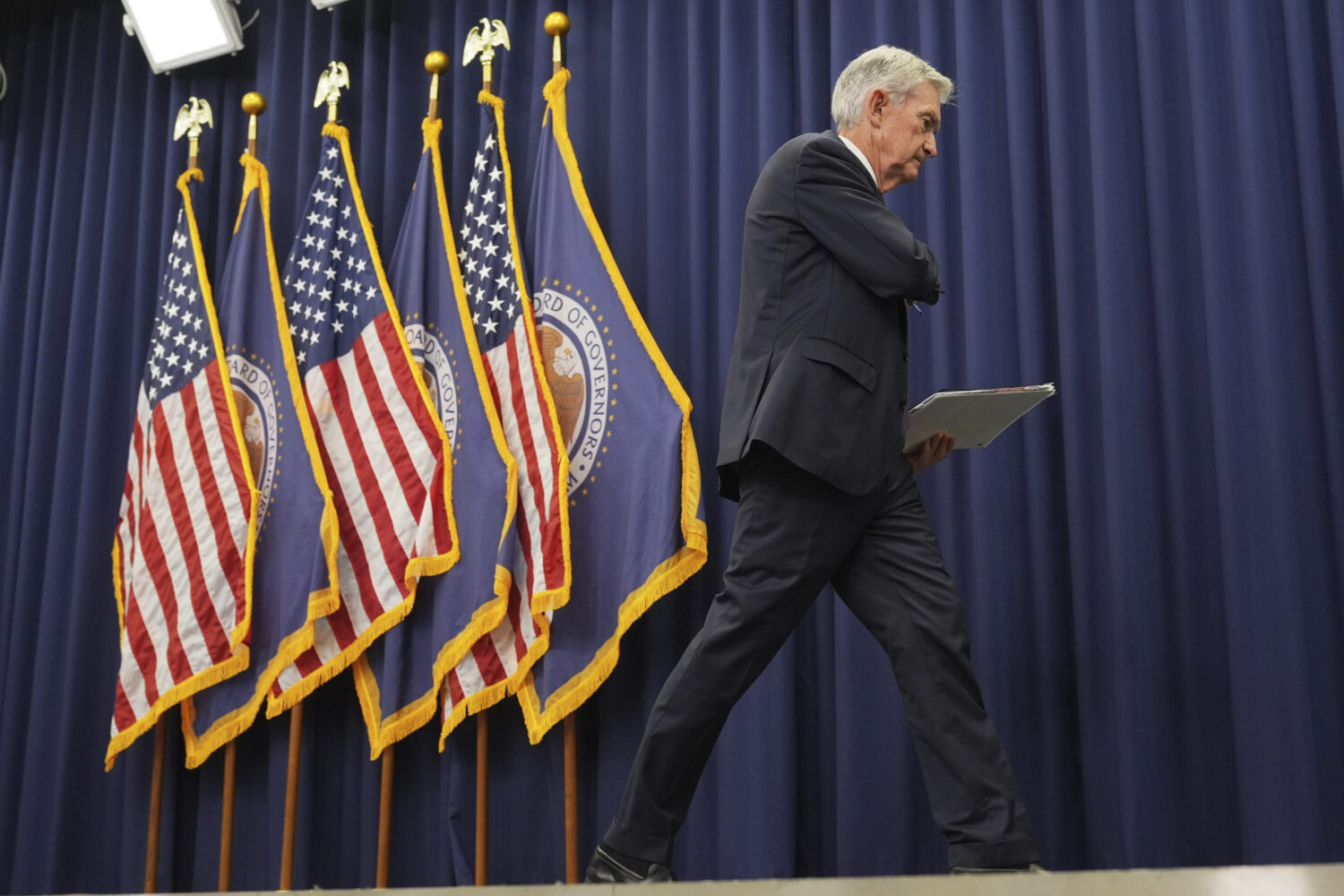 Federal Reserve Chairman Jerome Powell walks off after a news conference following the Federal Open...