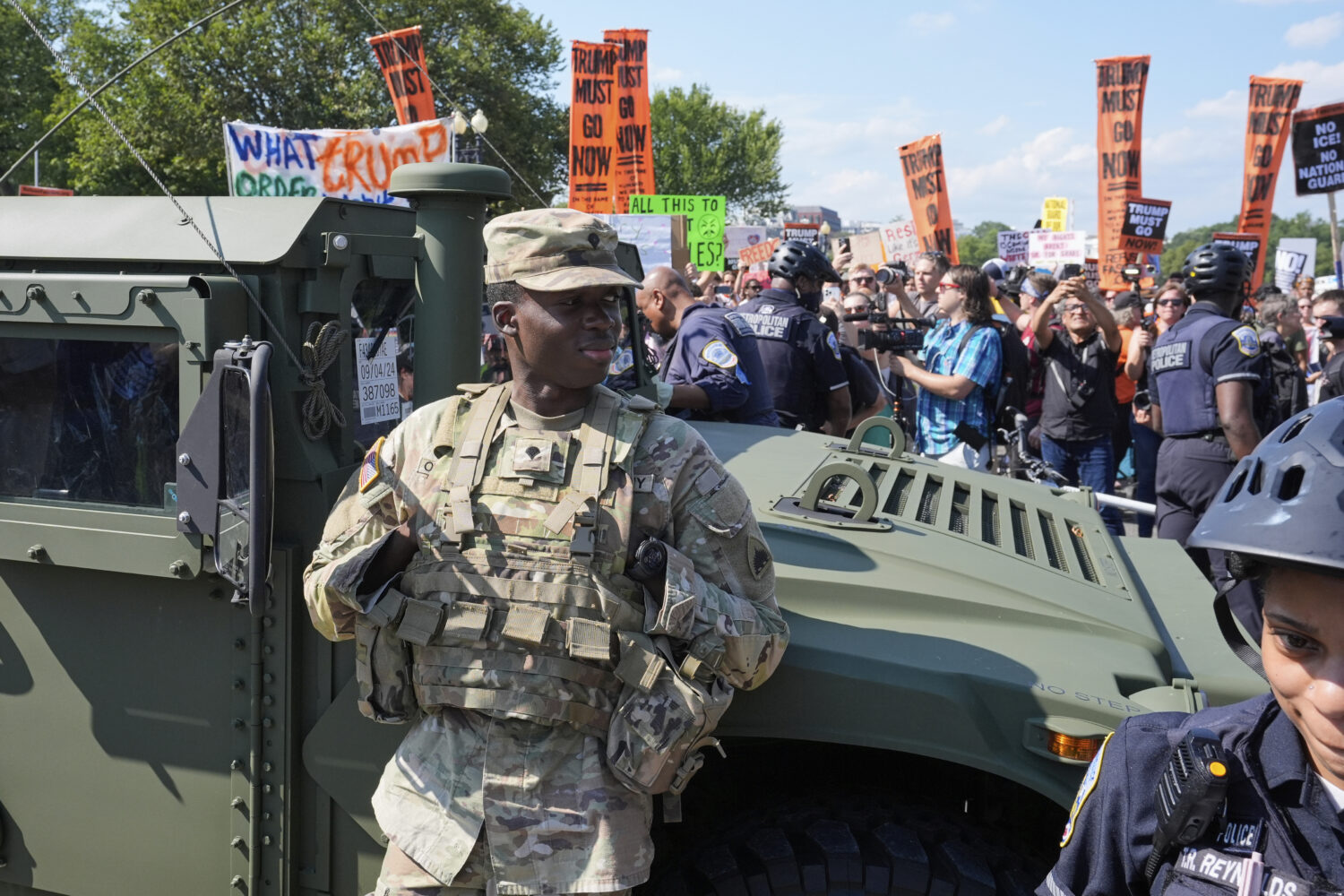 Washington Metropolitan Police officers and military police soldiers with the District of Columbia ...