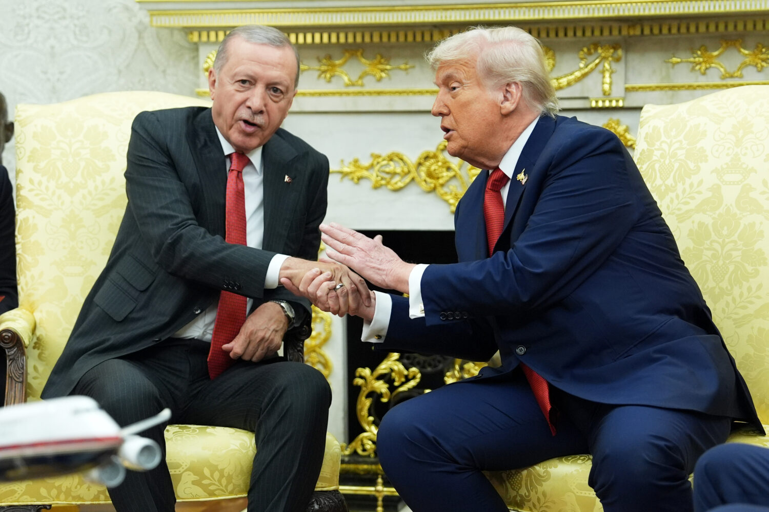 President Donald Trump, right, shakes the hand of Turkish President Recep Tayyip Erdogan during a m...