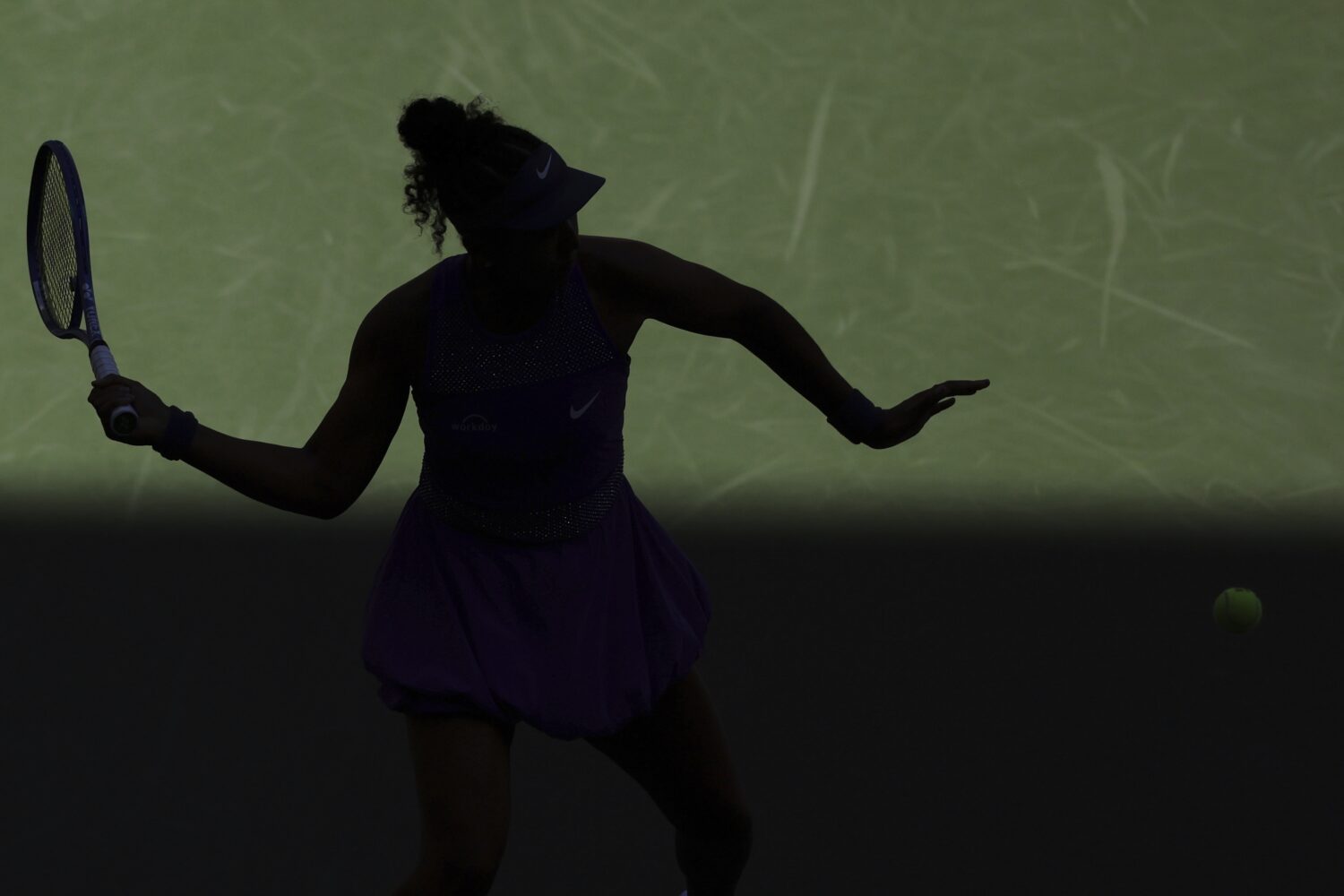 Naomi Osaka, of Japan, returns a shot against Daria Kasatkina, of Australia, during the third round...