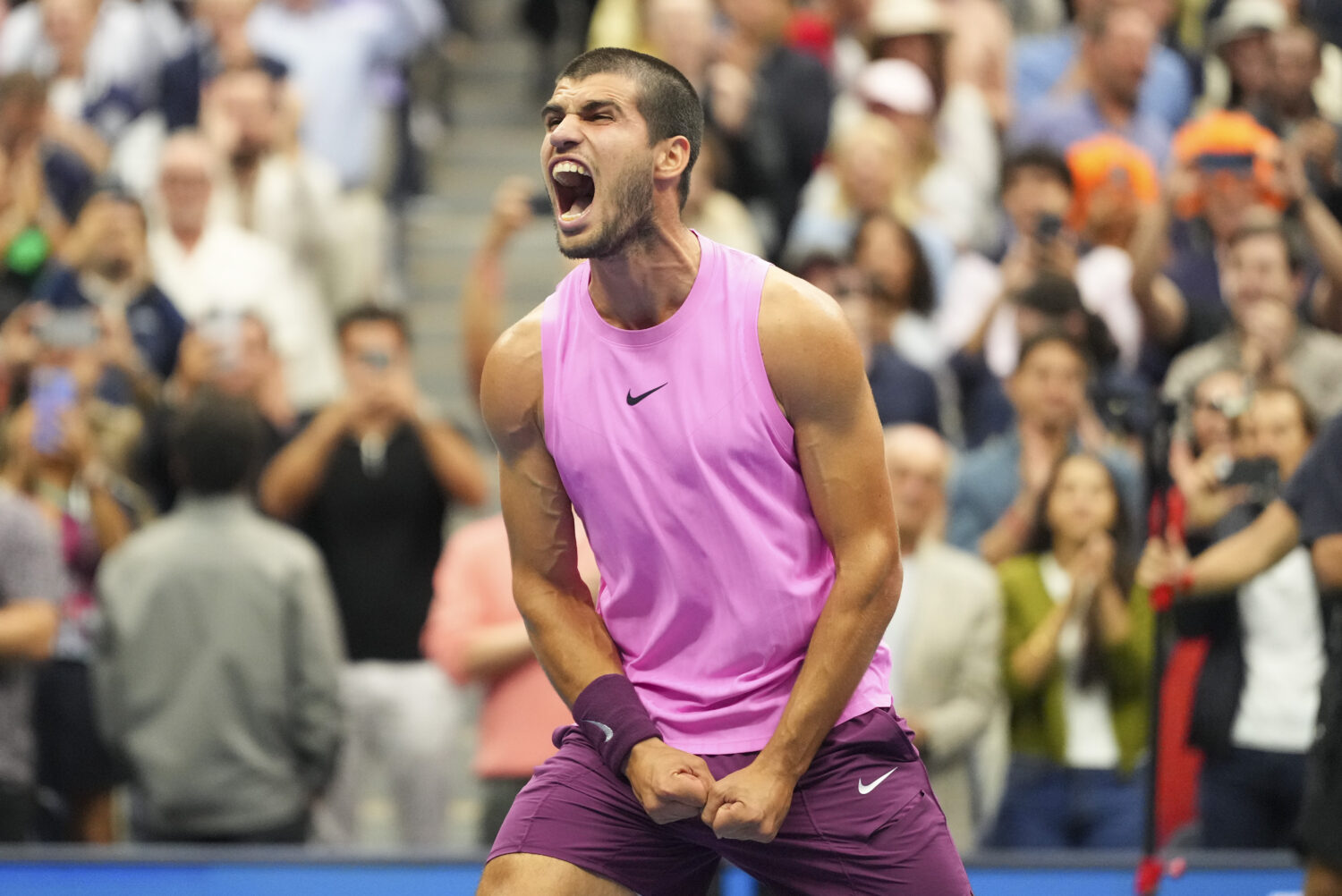Carlos Alcaraz, of Spain, celebrates after defeating Jannik Sinner, of Italy, in the men's singles ...