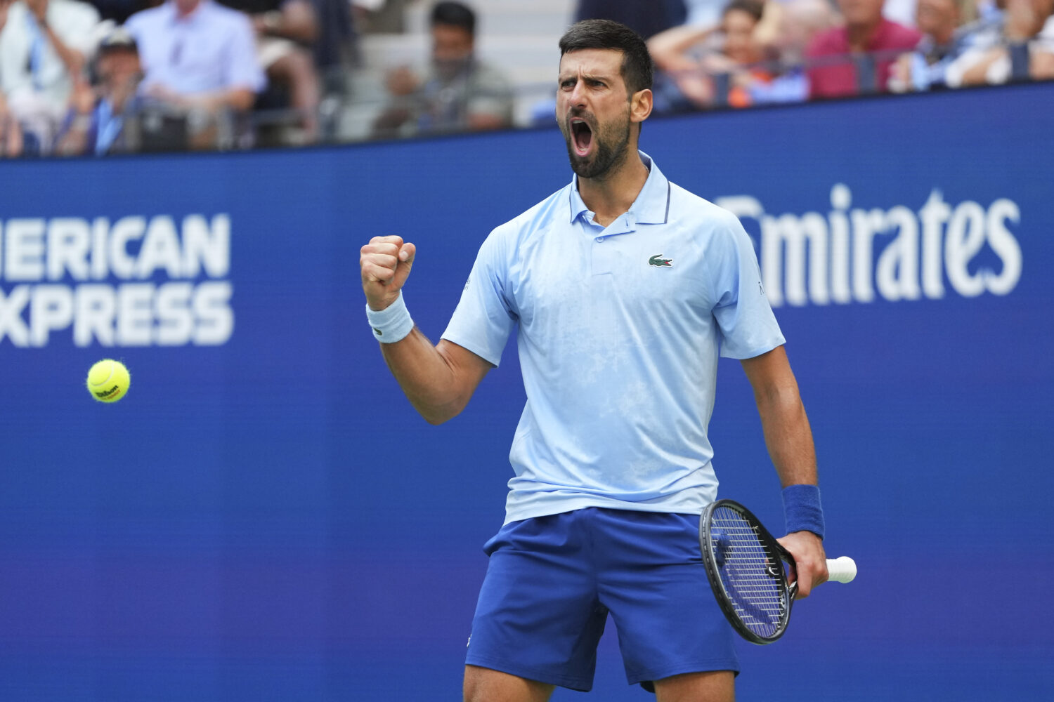 Novak Djokovic, of Serbia, reacts after scoring a point against Carlos Alcaraz, of Spain, during th...