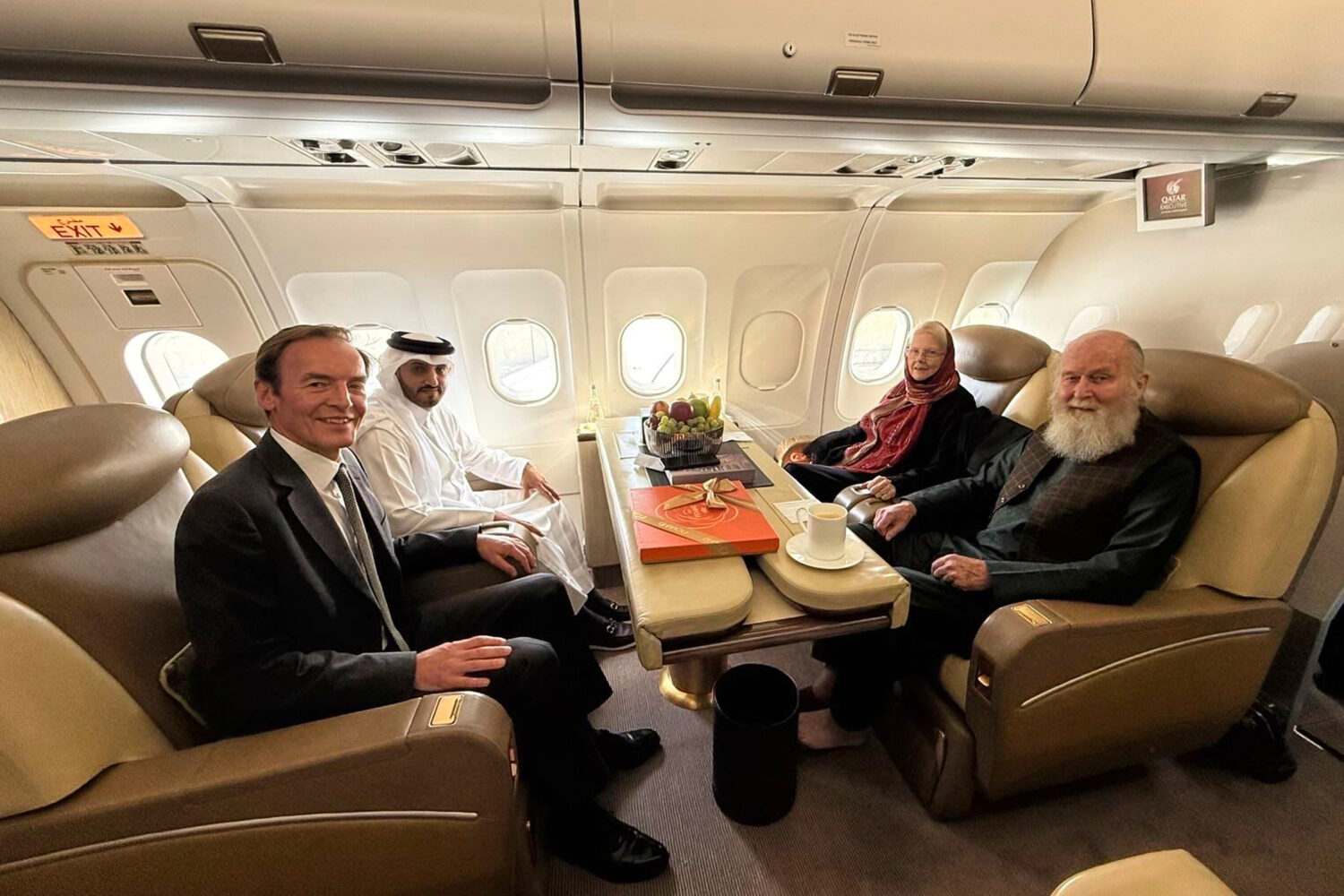In this photo provided by Qatar Foreign Ministry, Qatari and British diplomats, left, pose with the...