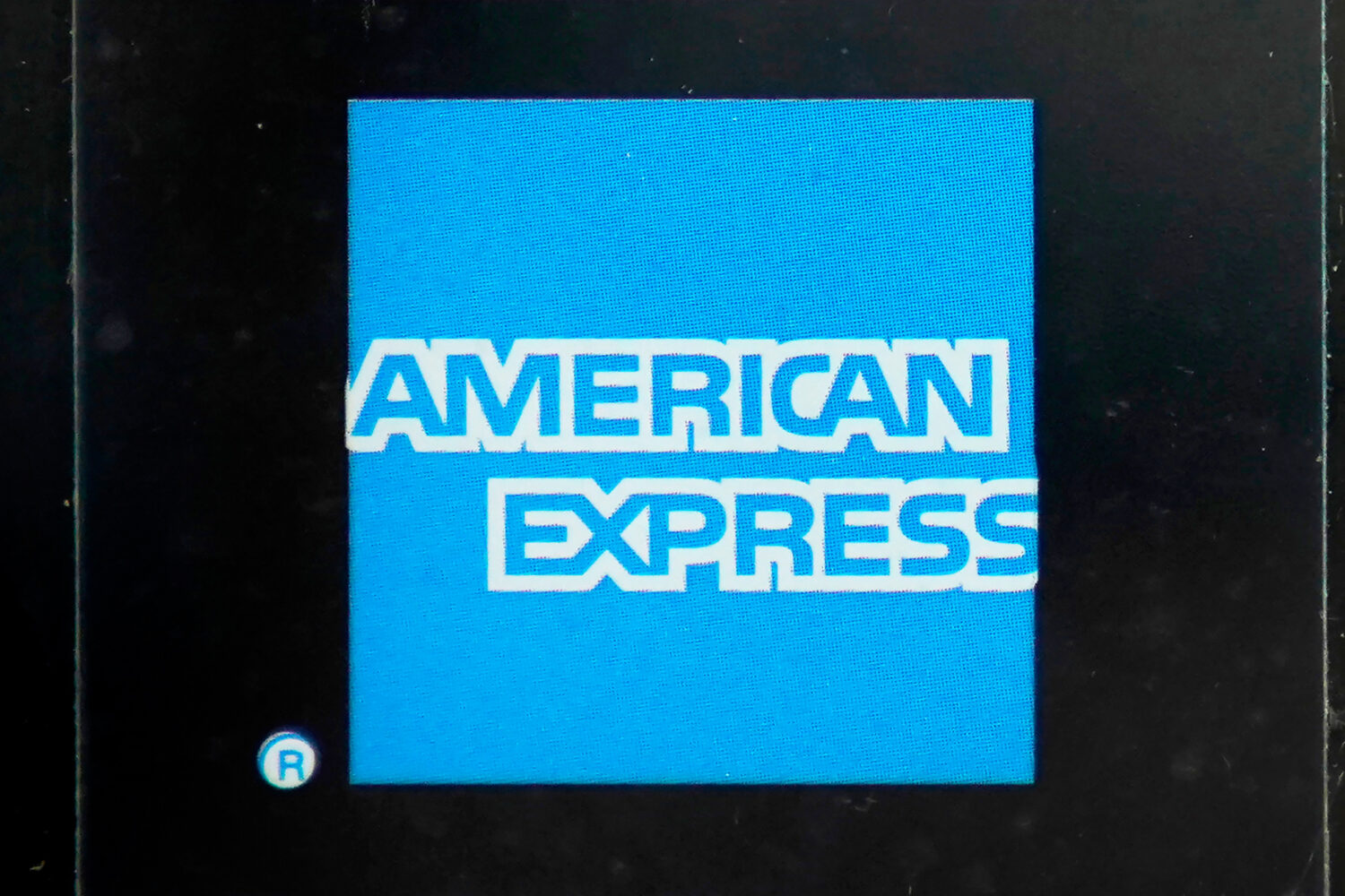 FILE - An American Express logo is attached to a door in Boston's Seaport District, Wednesday, July...