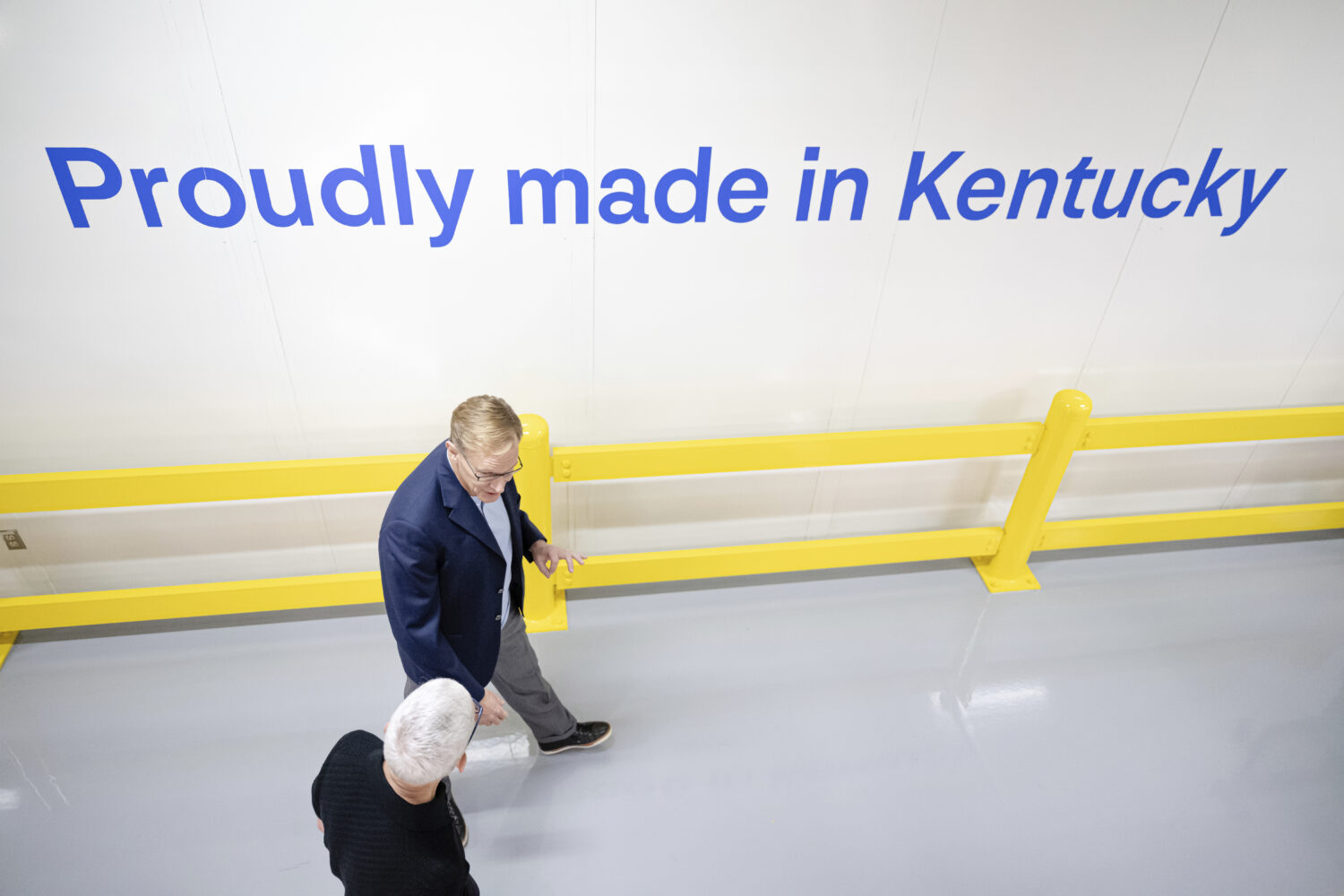 Apple CEO Tim Cook and Corning CEO Wendell Weeks walk during a tour of Corning's iPhone glass manuf...