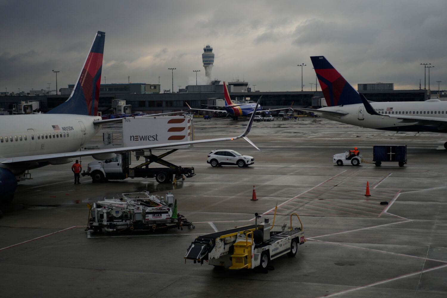 FILE - Delta Airlines planes are loaded along the B Concourse at the Hartsfield-Jackson Internation...