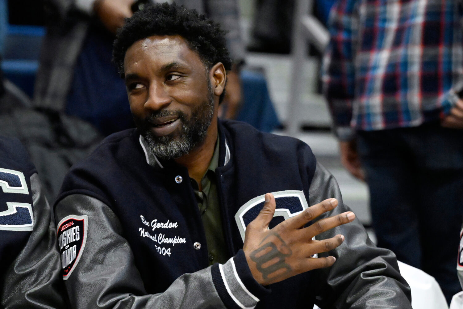 FILE- Former UConn and NBA player Ben Gordon sits on the sideline during a ceremony honoring the 20...