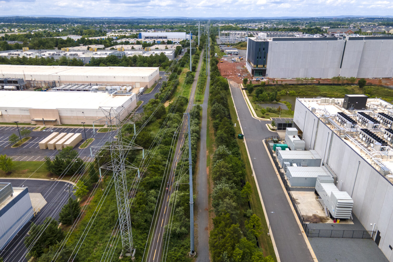 FILE - High-voltage transmission lines provide electricity to data centers in Ashburn in Loudon Cou...