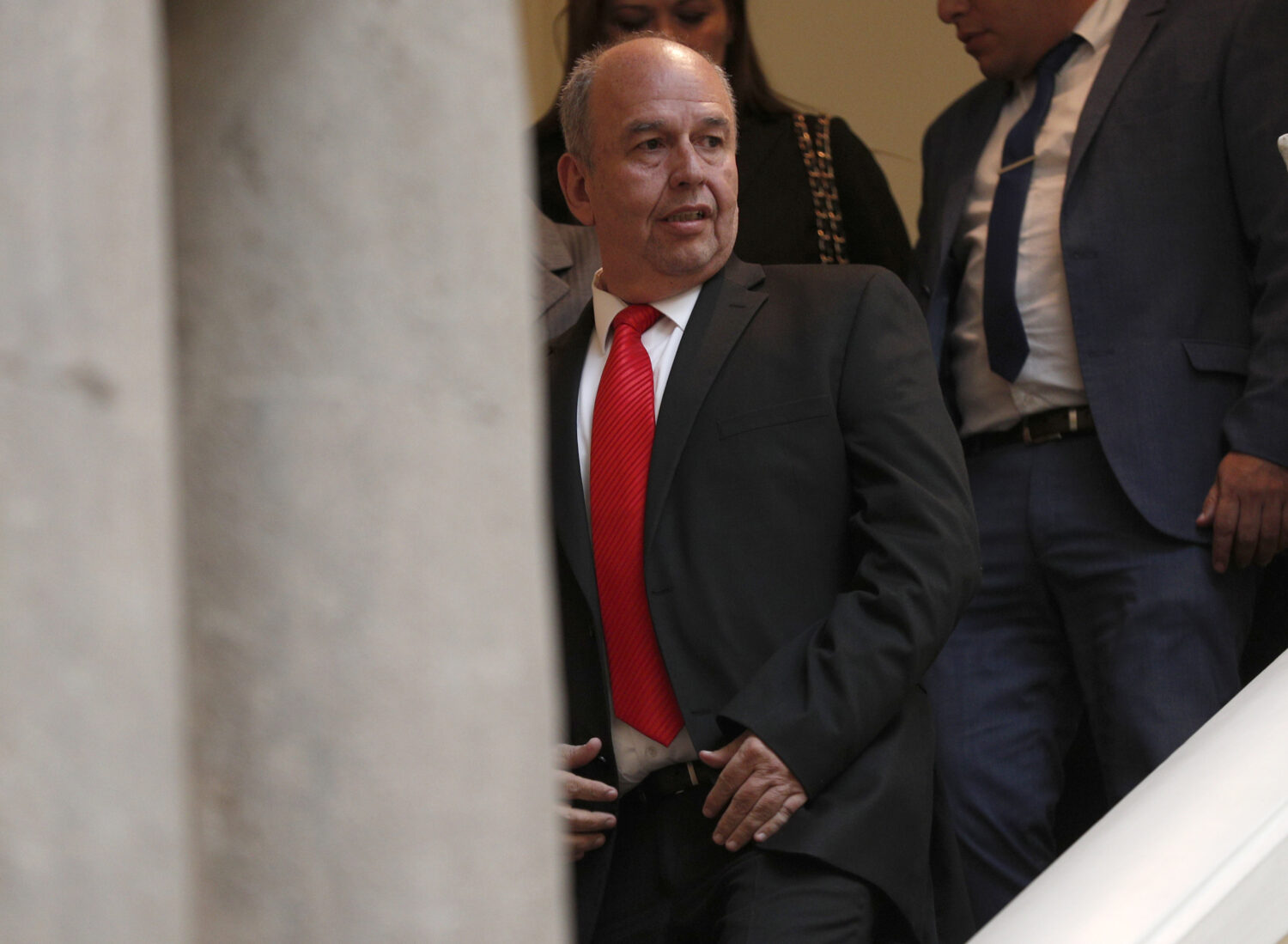 FILE - Bolivia's Government Minister Arturo Murillo walks down a set of stairs at the government pa...