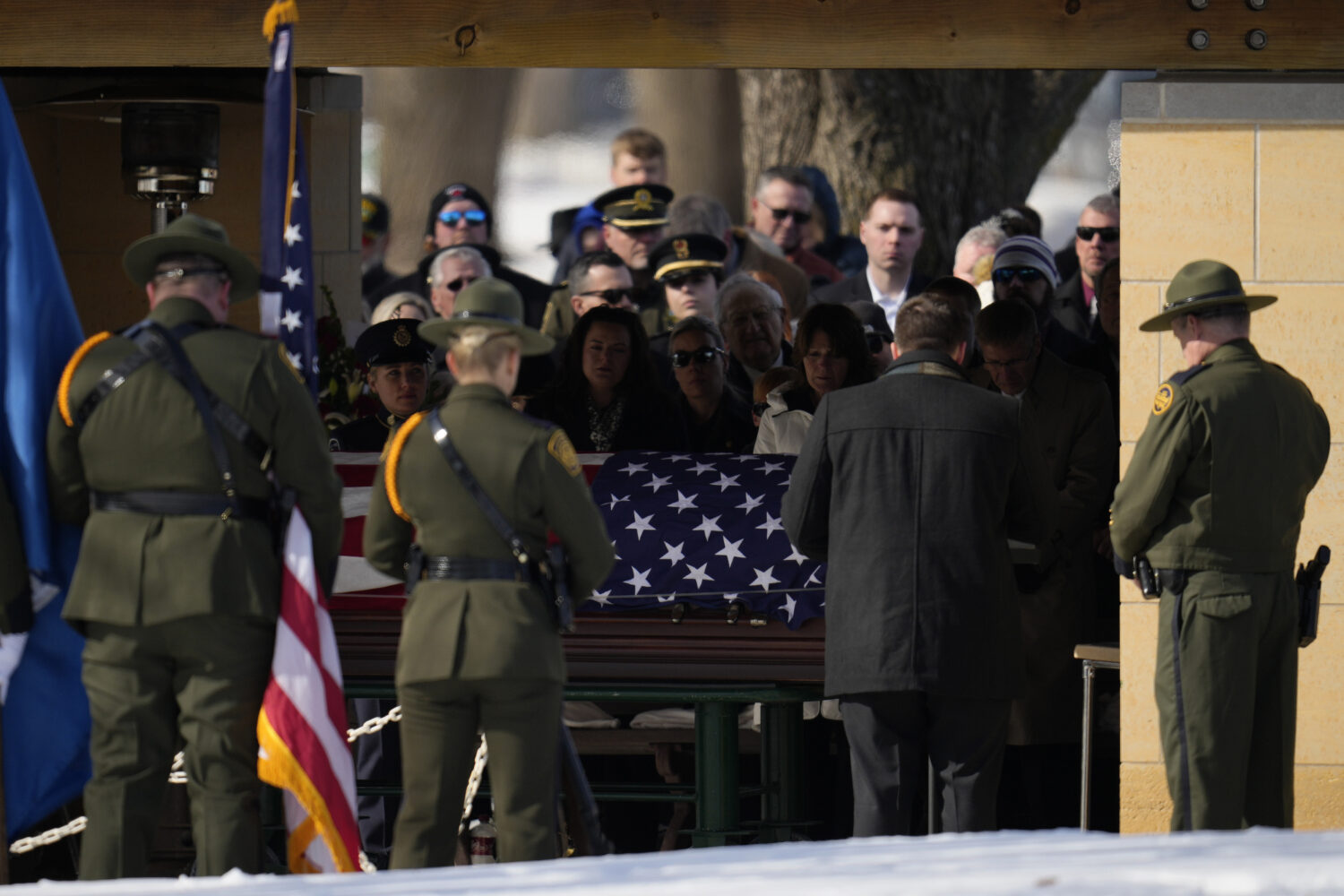 FILE - U.S. Border Patrol agent David Maland is recognized with military honors before his burial a...