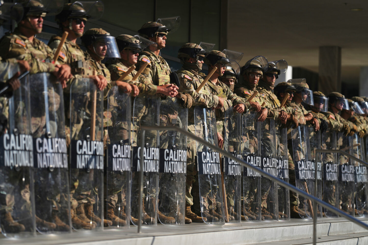FILE - California National Guard are positioned at the Federal Building, June 10, 2025, in downtown...