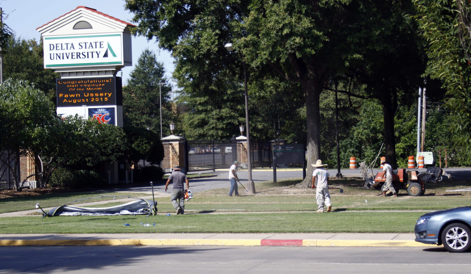 FILE - A grounds crew works on the lawn of Delta State University, in Cleveland, Miss., Sept. 15, 2...
