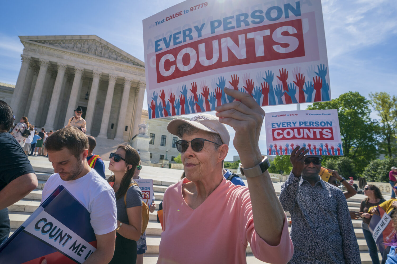 FILE - Immigration activists rally outside the Supreme Court as the justices hear arguments over th...