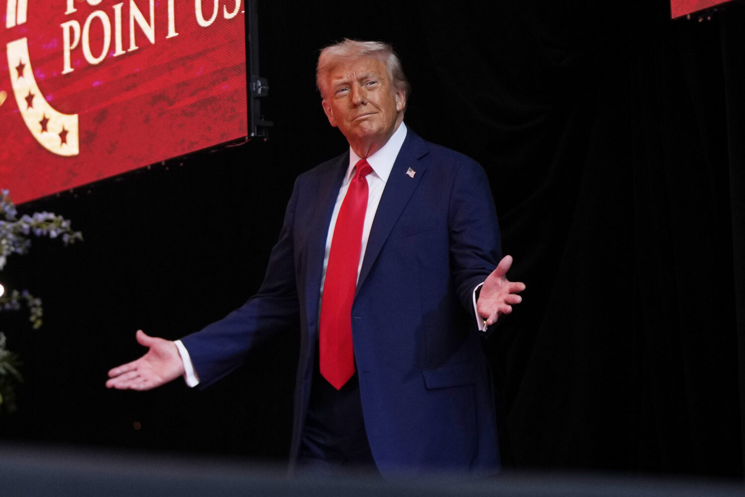 President Donald Trump arrives to speak at a memorial for conservative activist Charlie Kirk, Sunda...