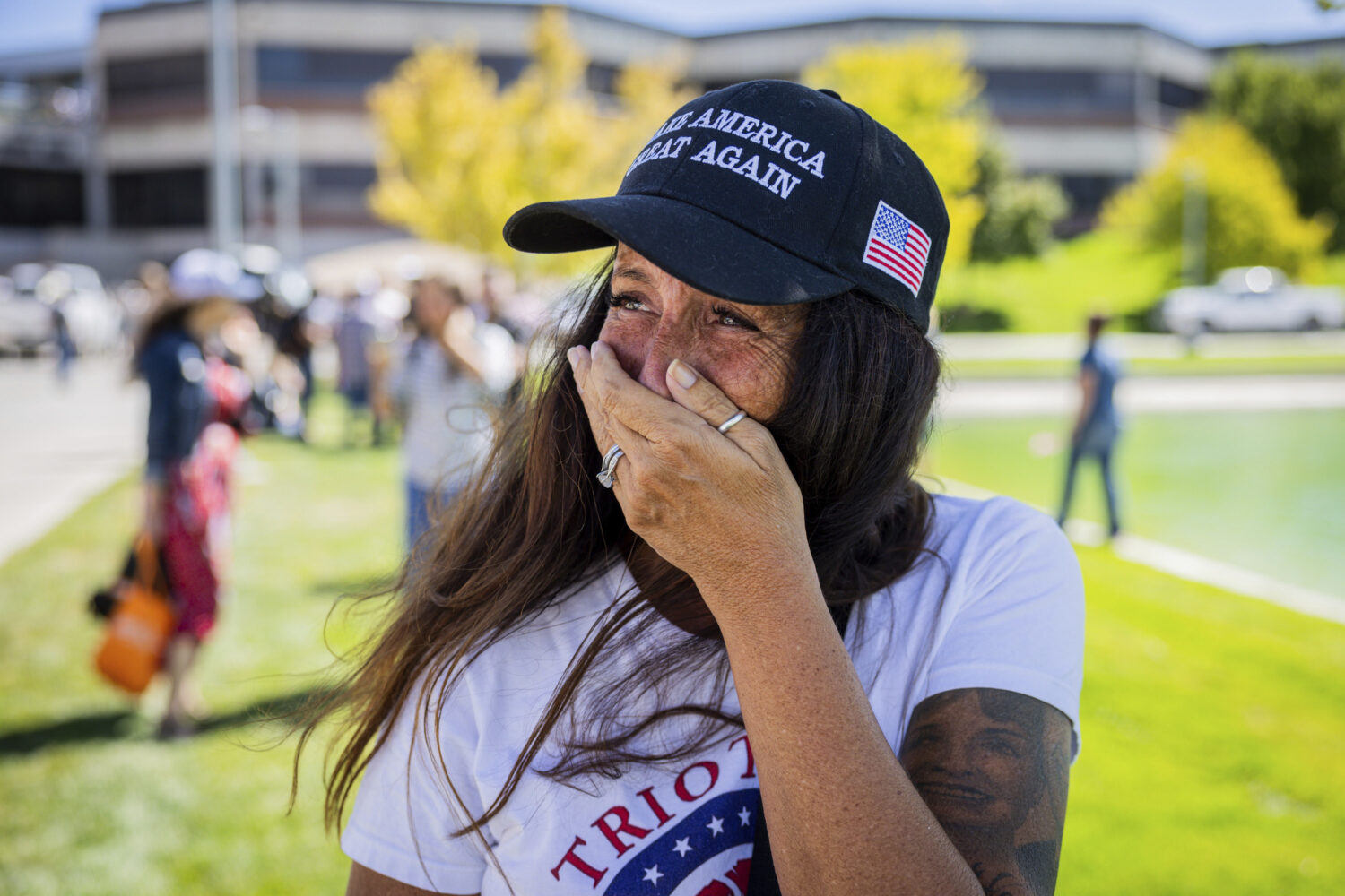 Allison Hemingway-Witty cries after Charlie Kirk is shot during Turning Point's visit to Utah Valle...
