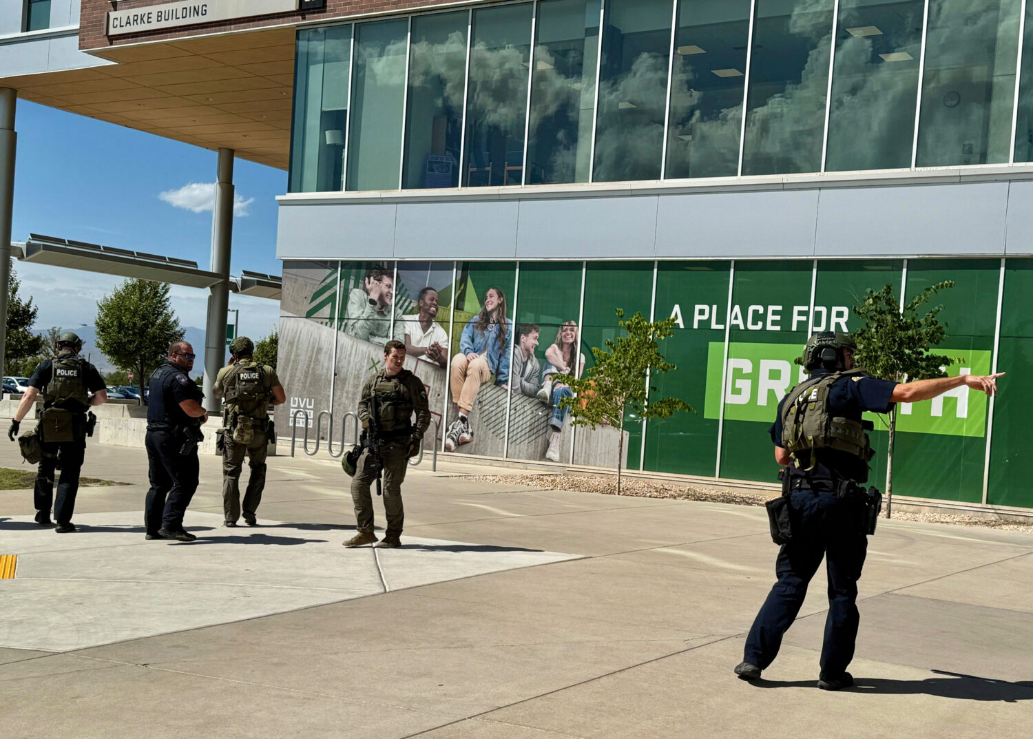 Police work on the campus after Charlie Kirk was shot during Turning Point's visit to Utah Valley U...