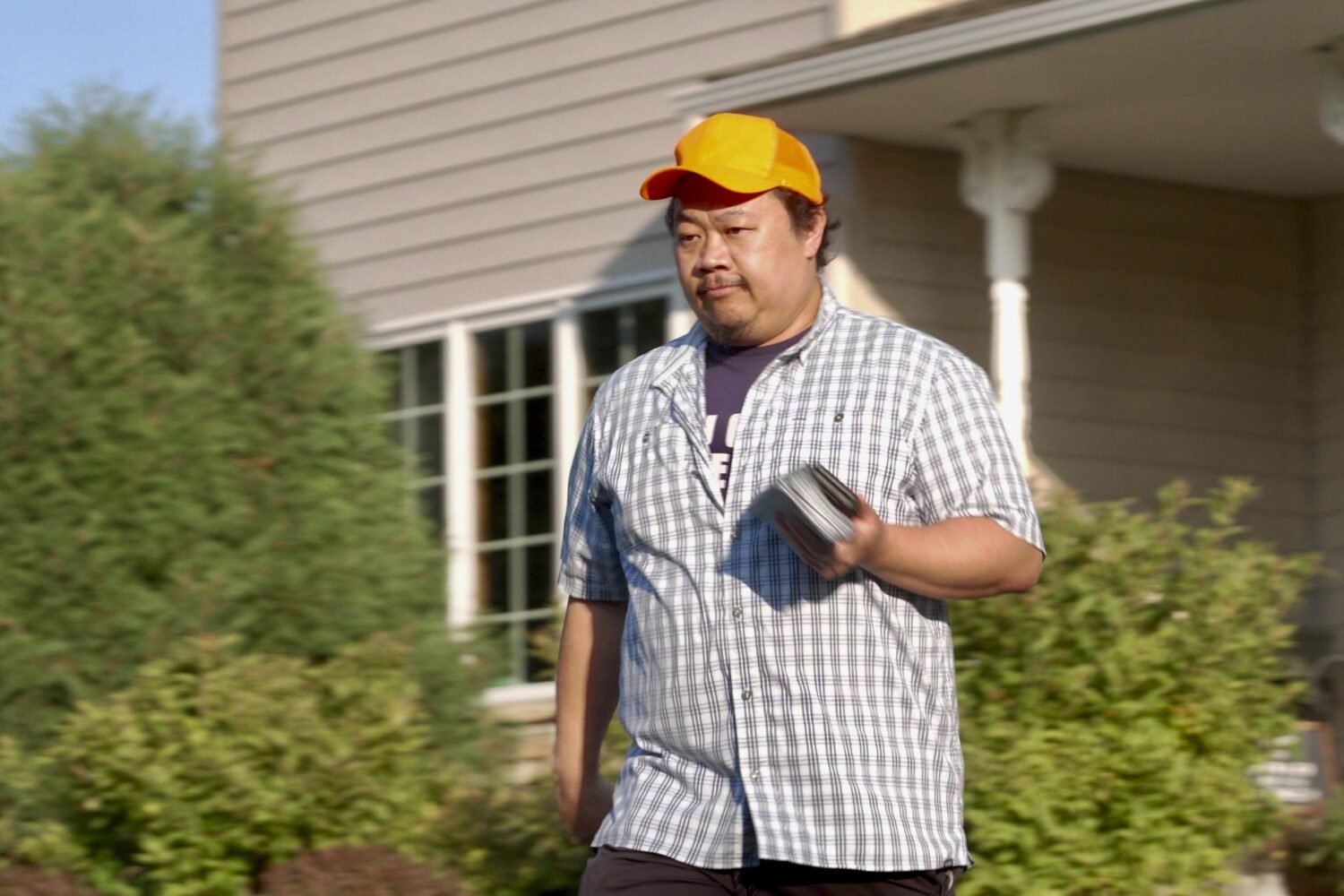 Xp Lee, Democratic candidate for Minnesota house district 34B, knocks on doors during campaigning i...