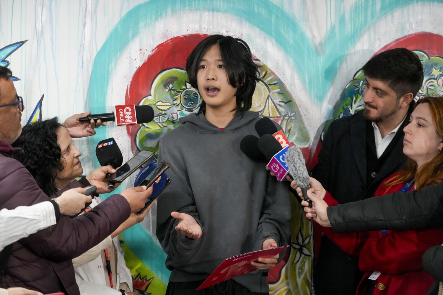 U.S. influencer Ethan Guo speaks with journalists at an event about his donation to children's canc...
