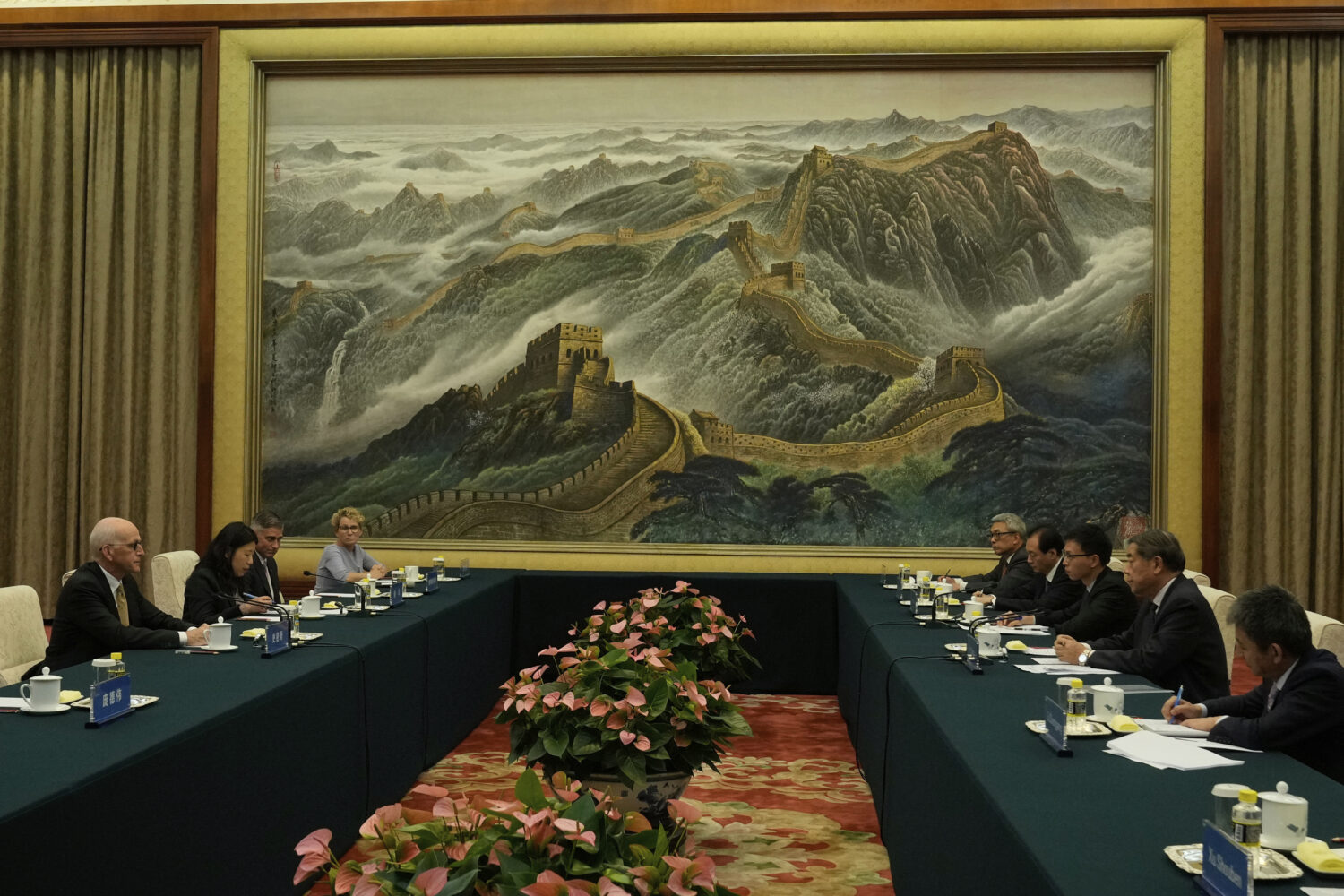 Chinese Vice Premier He Lifeng, second from right, speaks with Rep. Adam Smith, D-Wash, left, as he...