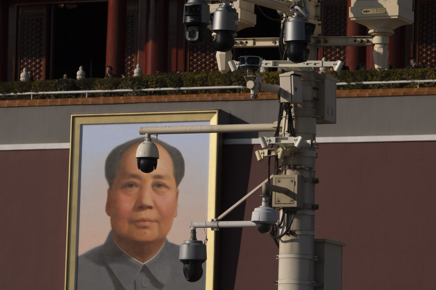 Security cameras are seen by a portrait of late Chinese leader Mao Zedong near Tiananmen Gate in Be...