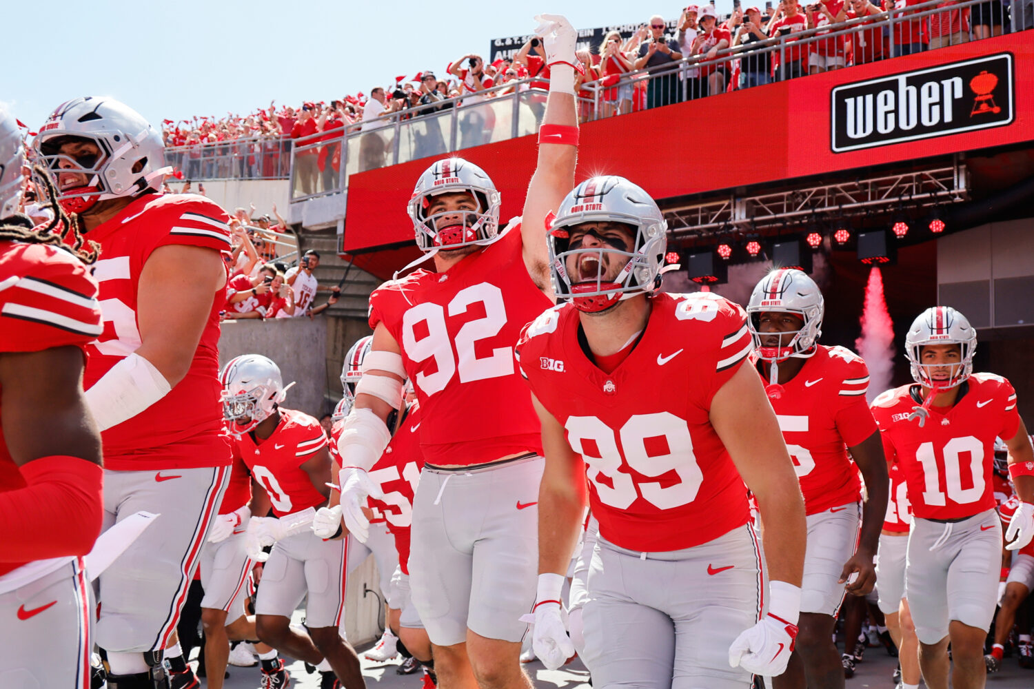 Ohio State players run on to the field for their NCAA college football game against Texas, Saturday...