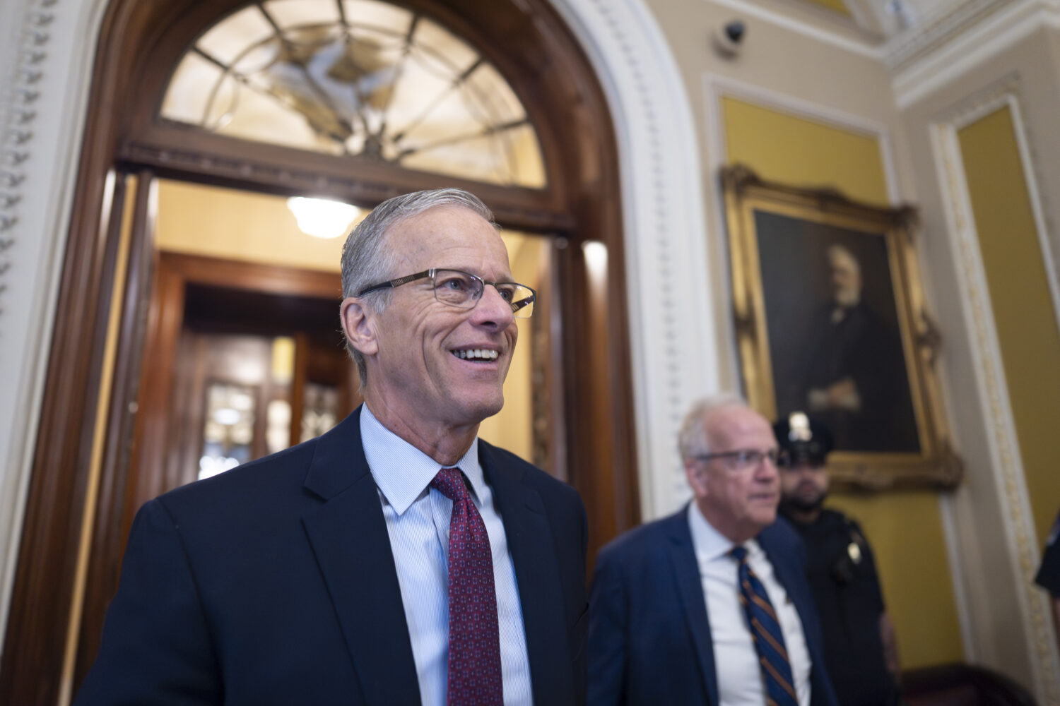 Senate Majority Leader John Thune, R-S.D., is met by reporters as he walks to his office while Cong...