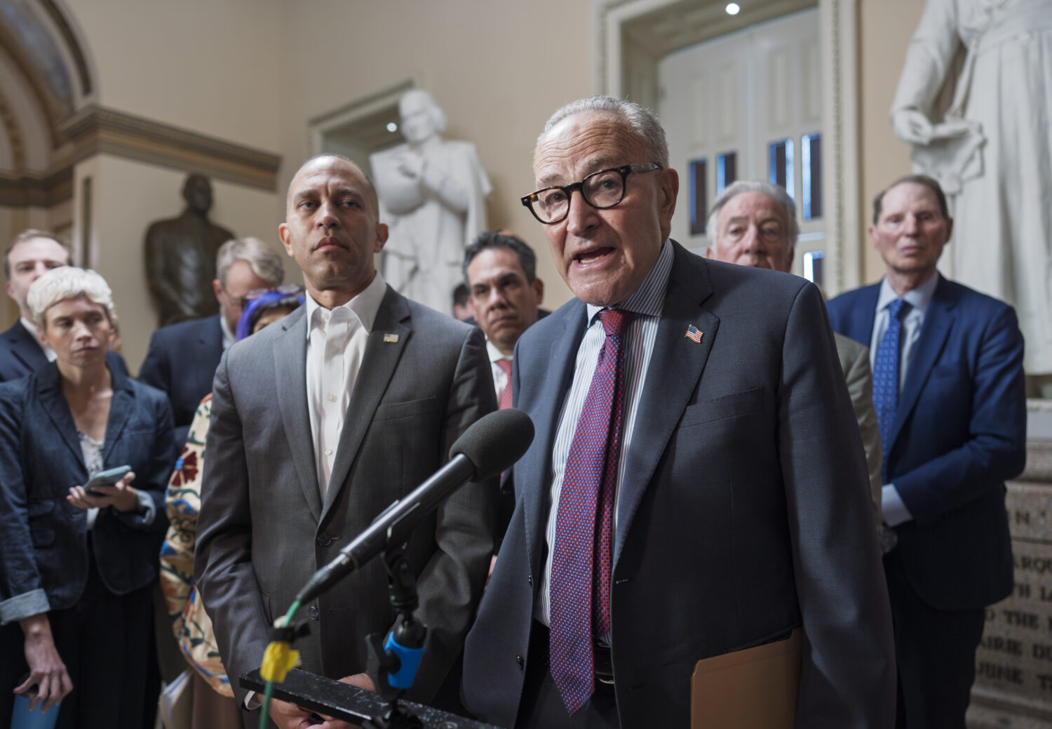 FILE—House Minority Leader Hakeem Jeffries, D-N.Y., left, and Senate Minority Leader Chuck Schume...