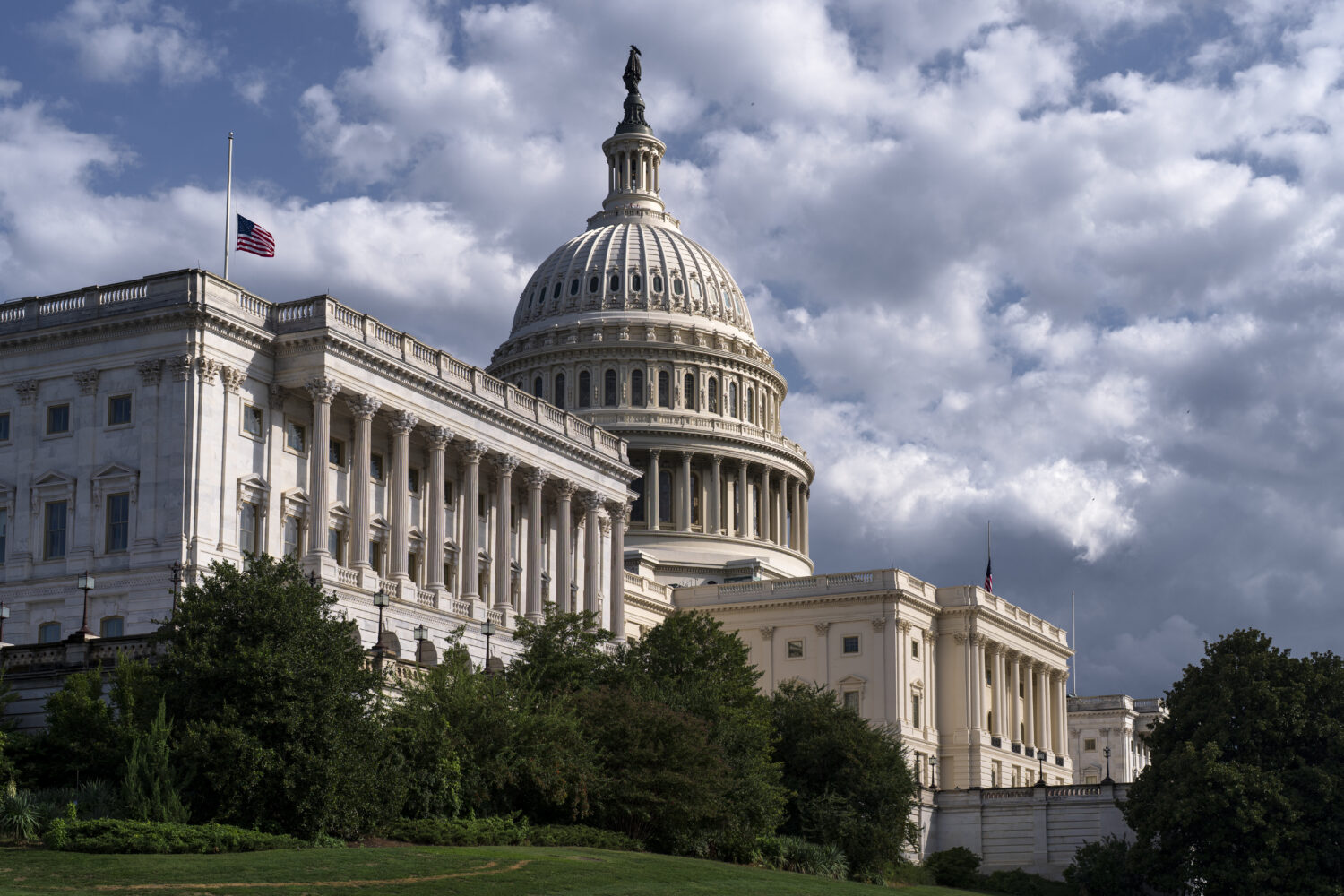 The west front of the Capitol is seen in Washington, Thursday, Sept. 11, 2025, where the flags have...
