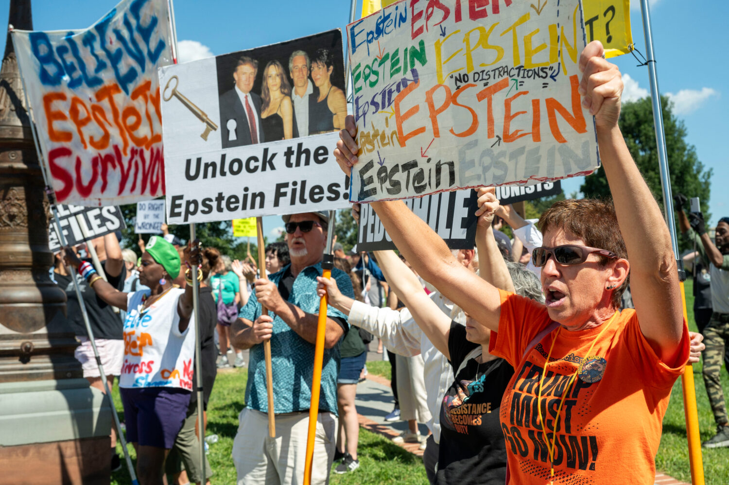 Protesters rally at a news conference calling for Congress to release all of the Jeffrey Epstein fi...