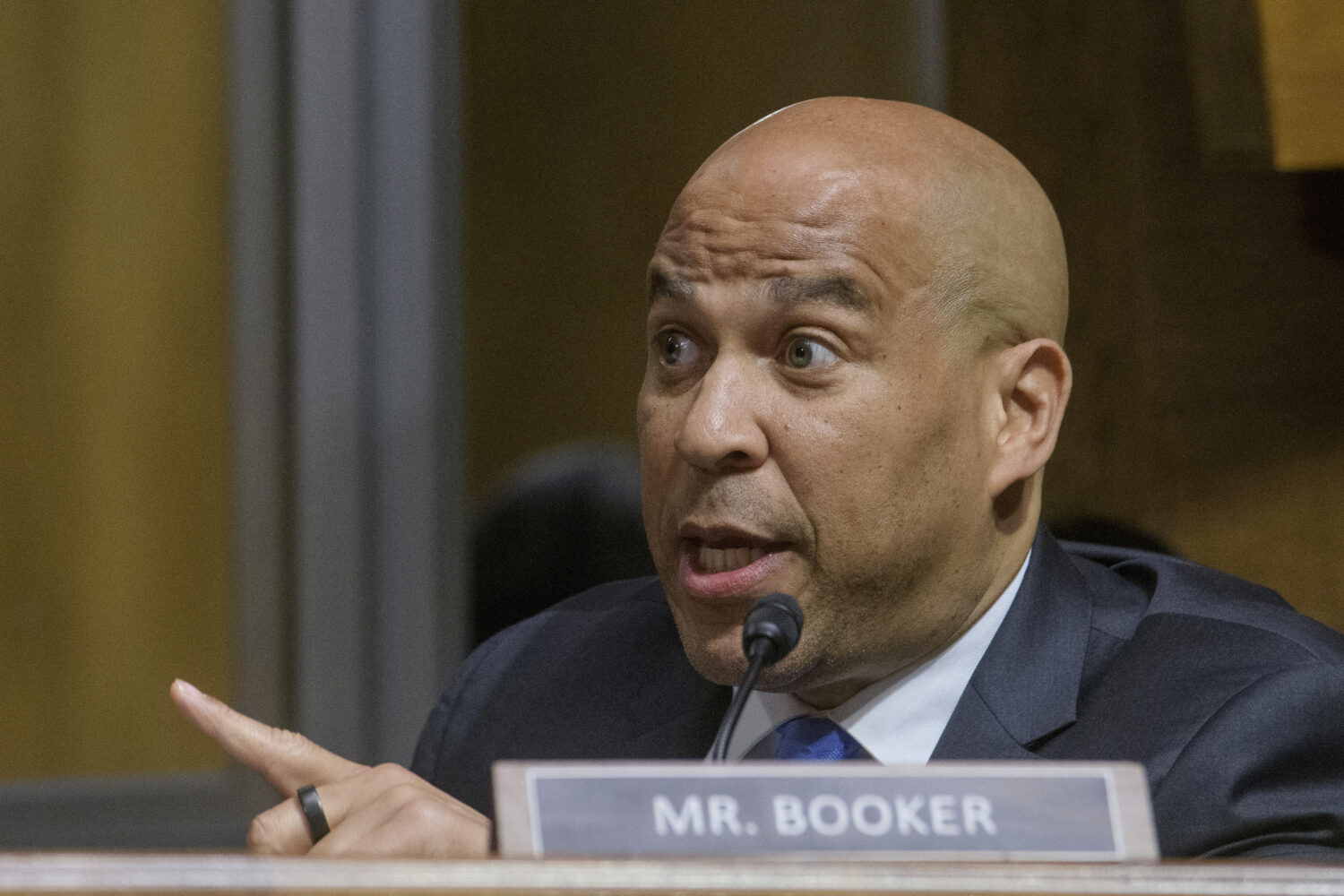 FILE - Sen. Cory Booker, D-N.J., has an exchange with Subcommittee Chairman Sen. Ted Cruz, R-Texas,...