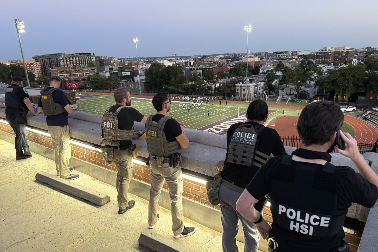 Officers from Metropolitan Police Department, FBI, and Homeland Security Investigations (HSI), are ...