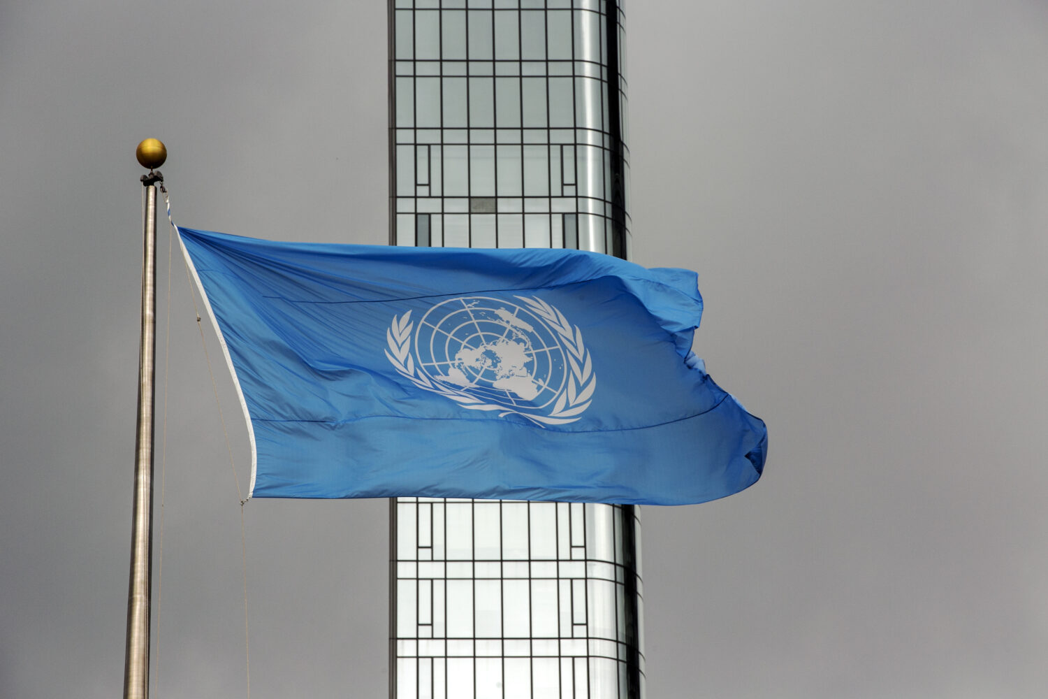 FILE - The UN flag flies on a stormy day at the United Nations during the United Nations General As...