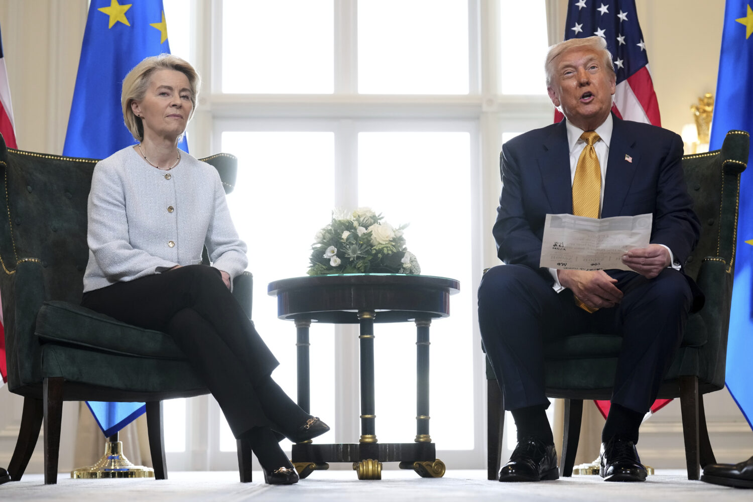 FILE - President Donald Trump reads from a paper and European Commission President Ursula von der L...
