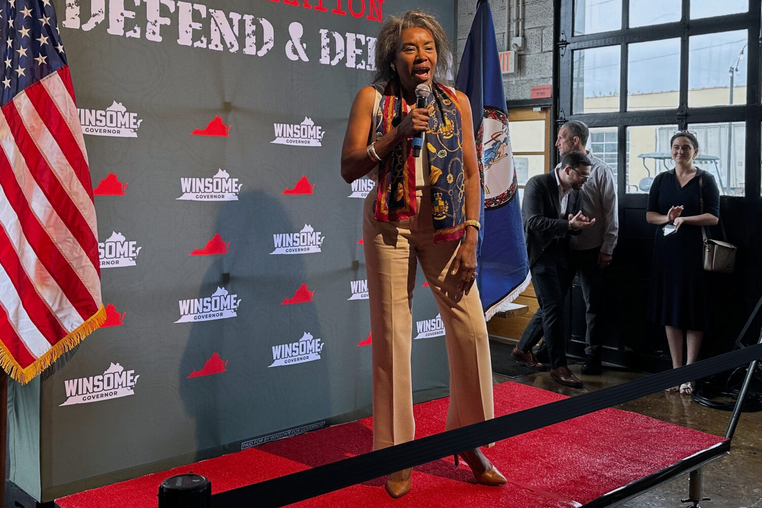 Republican Winsome Earle-Sears greets voters at her military-themed rally at Saucy’s Sit-Down Bar...