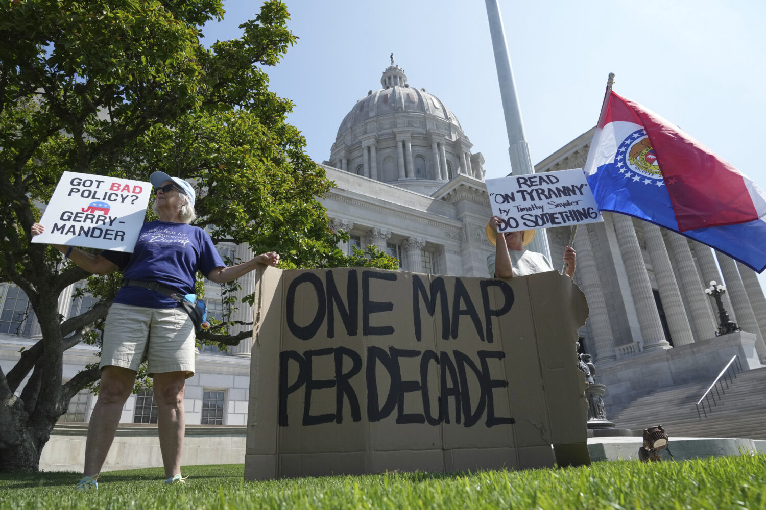 Robin Rothove, left, and Paula Smith, right, demonstrate outside the Missouri Capitol as lawmakers ...