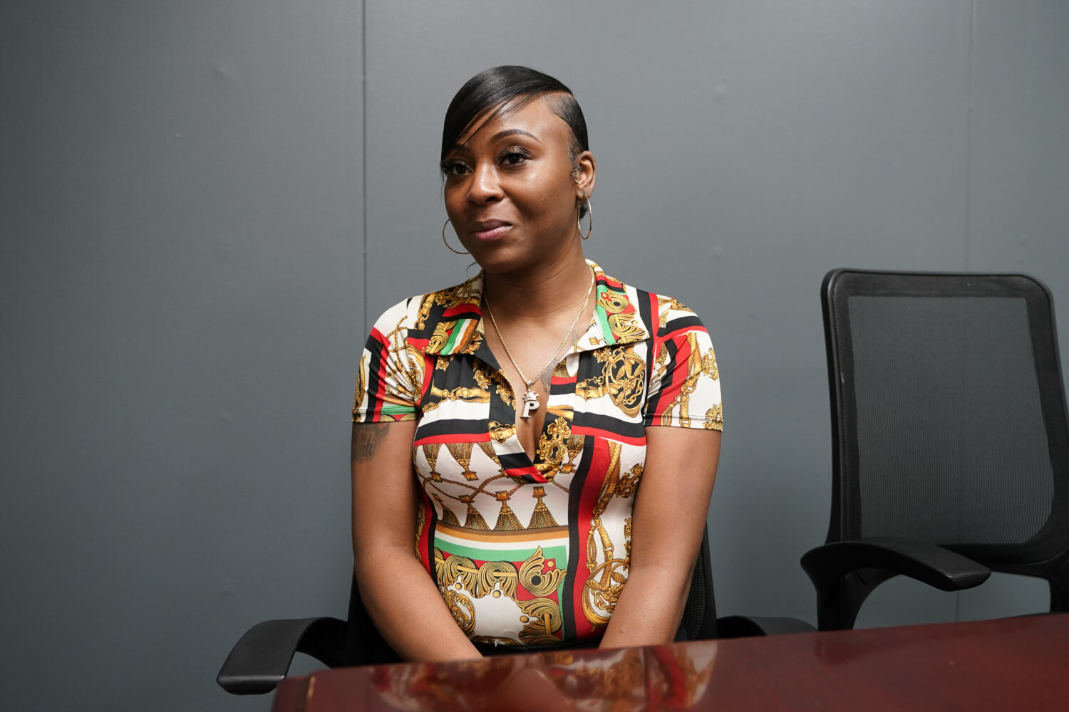 FILE - Porcha Woodruff poses for a portrait on Aug. 7, 2023, in Oak Park, Mich. (AP Photo/Carlos Os...