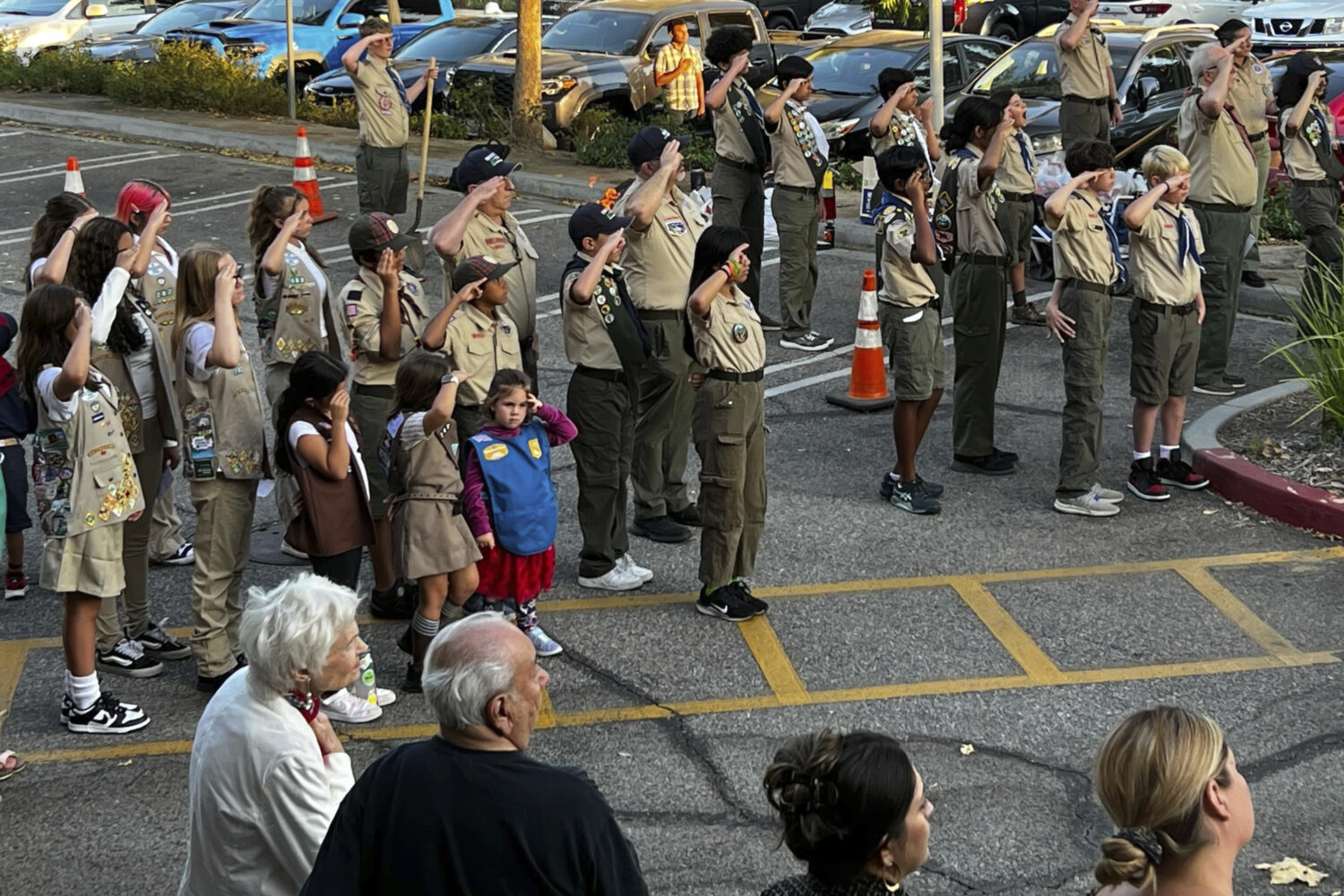 Scout Troop 228 participates in the U.S. flag retirement ceremony for Saint Kateri Tekakwitha Churc...