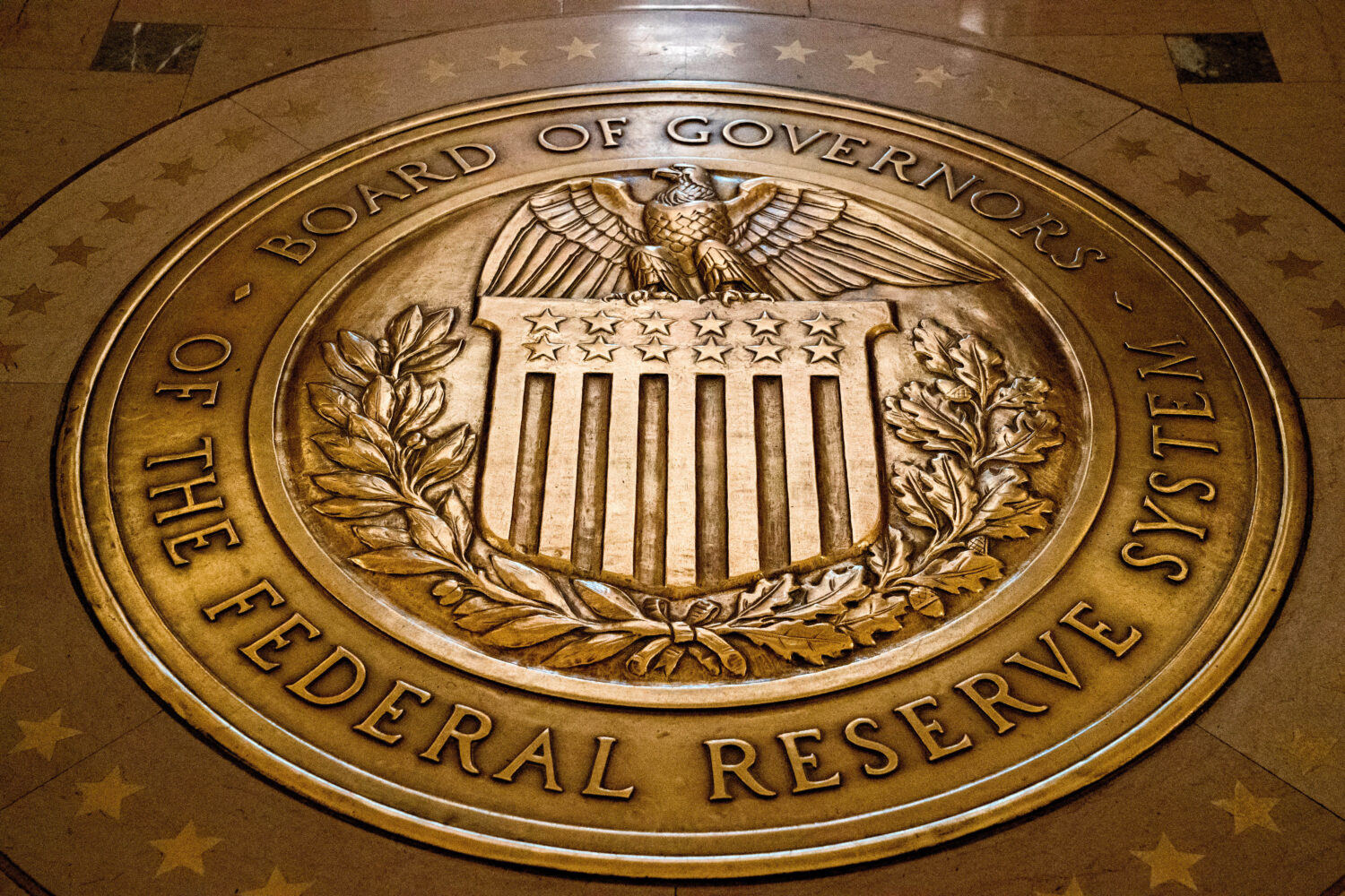 FILE- In this Feb. 5, 2018, file photo, the seal of the Board of Governors of the United States Fed...