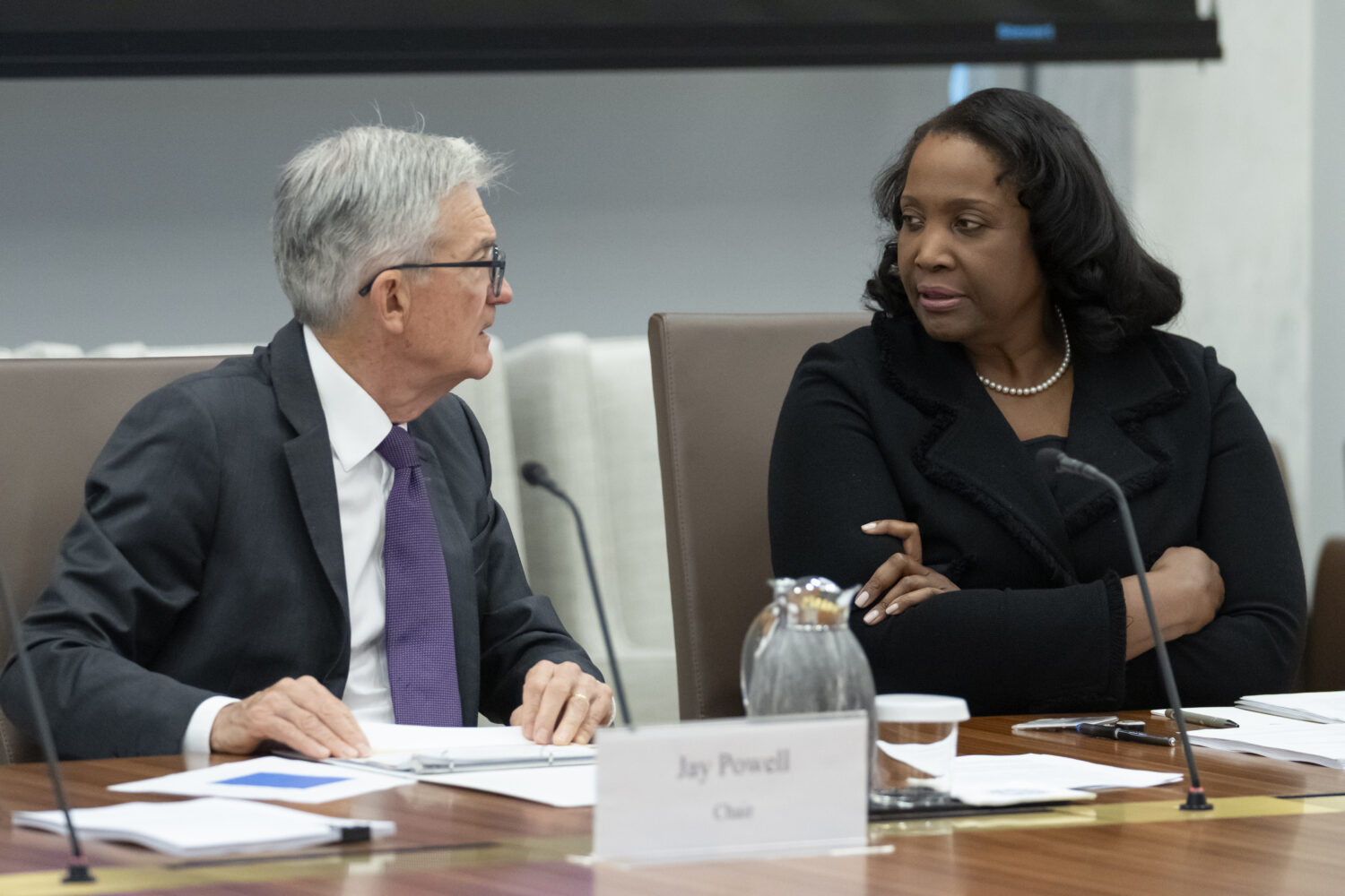 FILE - Federal Reserve Chairman Jerome Powell, left, talks with Board of Governors member Lisa Cook...