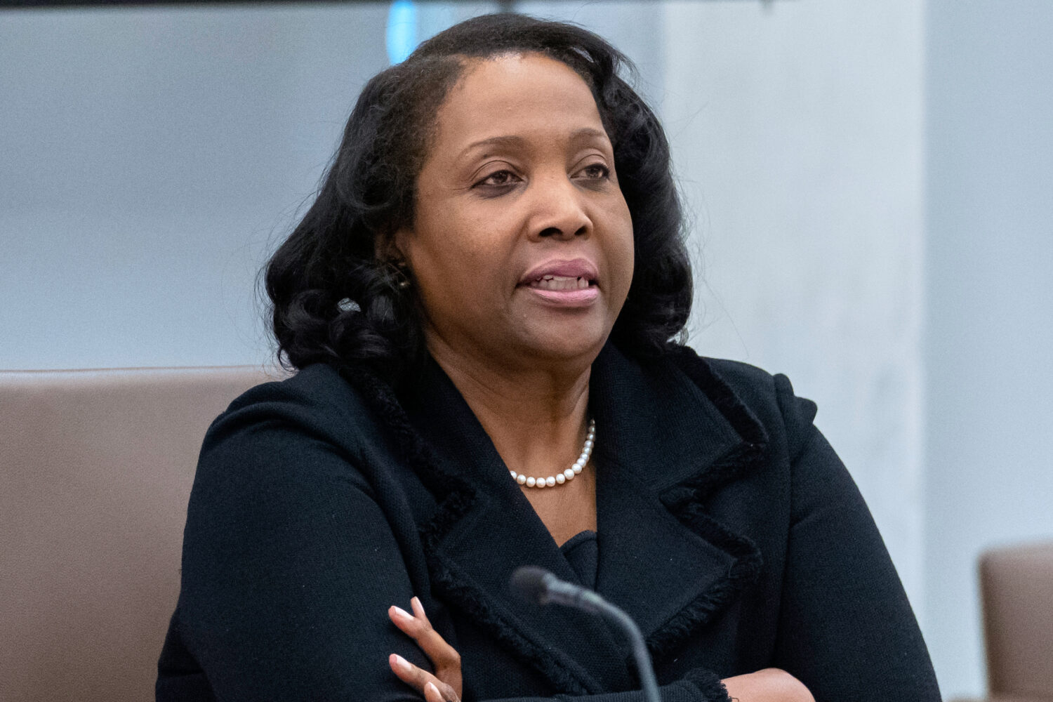 FILE - Federal Reserve Board of Governors member Lisa Cook listens during an open meeting of the Bo...